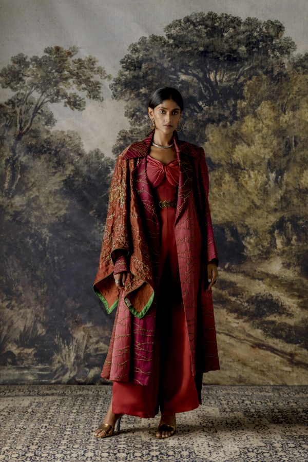 Stylish multi-hued jumpsuit with a jacket featuring intricate antique scrawl embroidery in rose and ruby tones