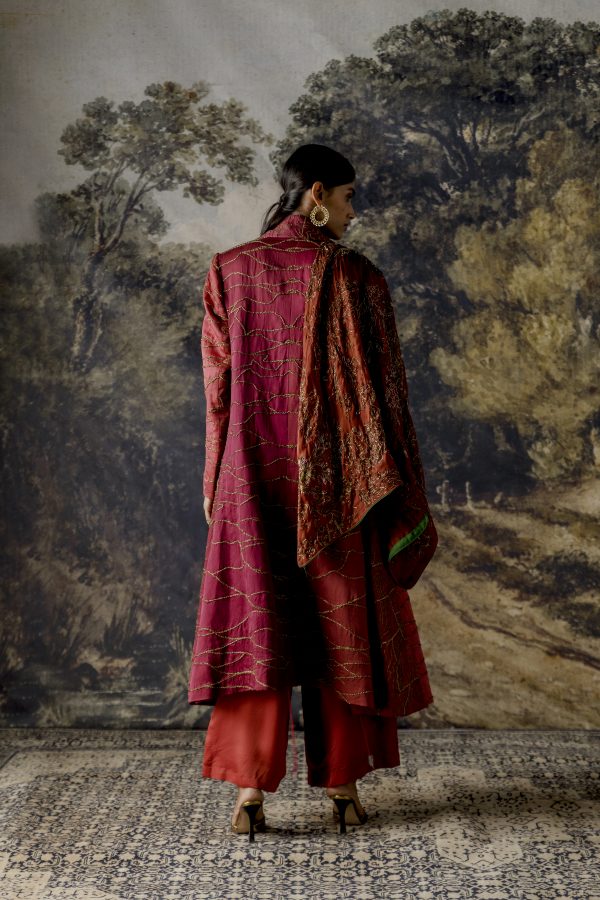 Back view of the stylish jumpsuit with a jacket, showcasing the design and fit from behind