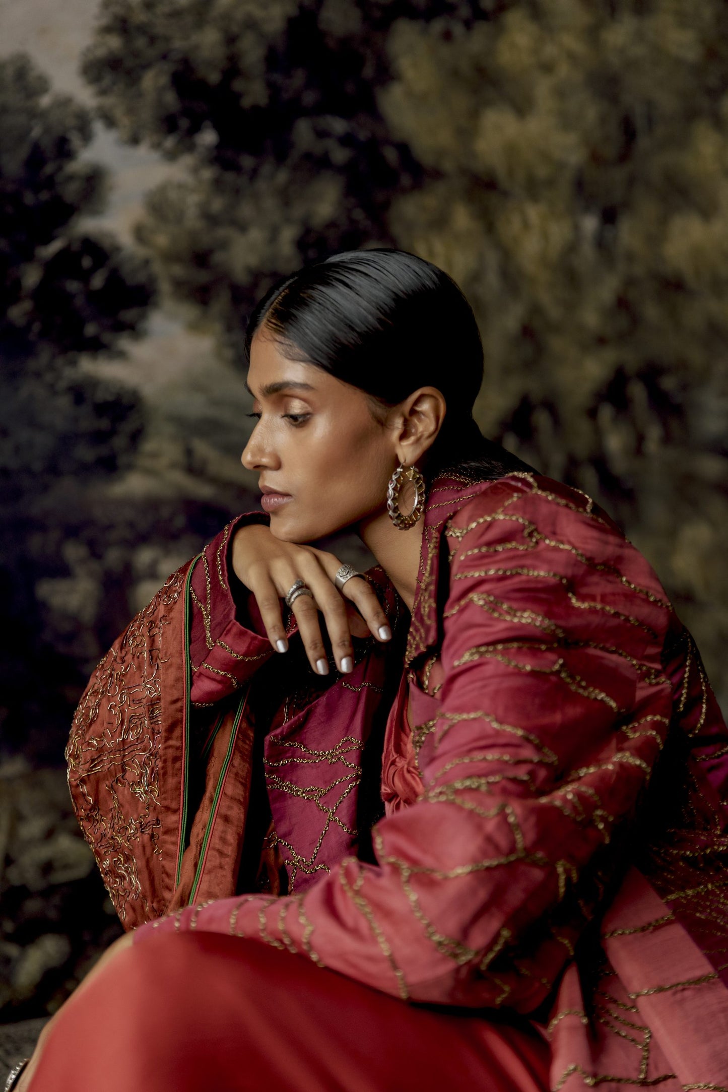 Side view of the stylish multi-hued jumpsuit with a jacket and stole, highlighting the chic look
