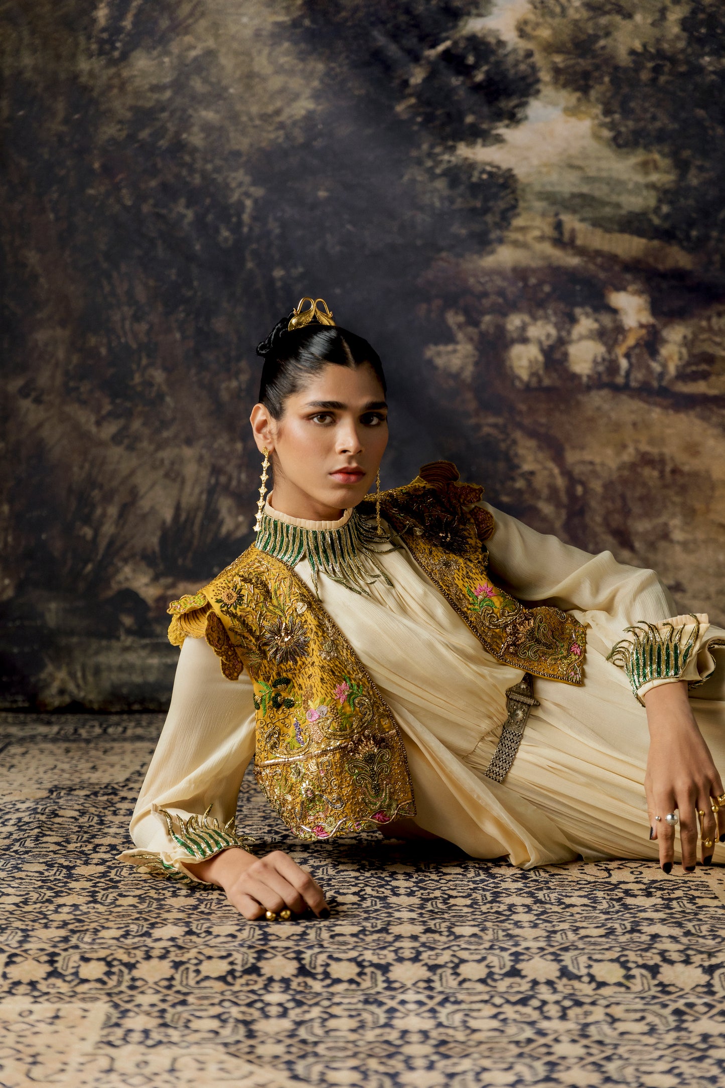 Rumi Gown with cape and cropped jacket, highlighting the metallic embroidery and rich textures on the gown and jacket
