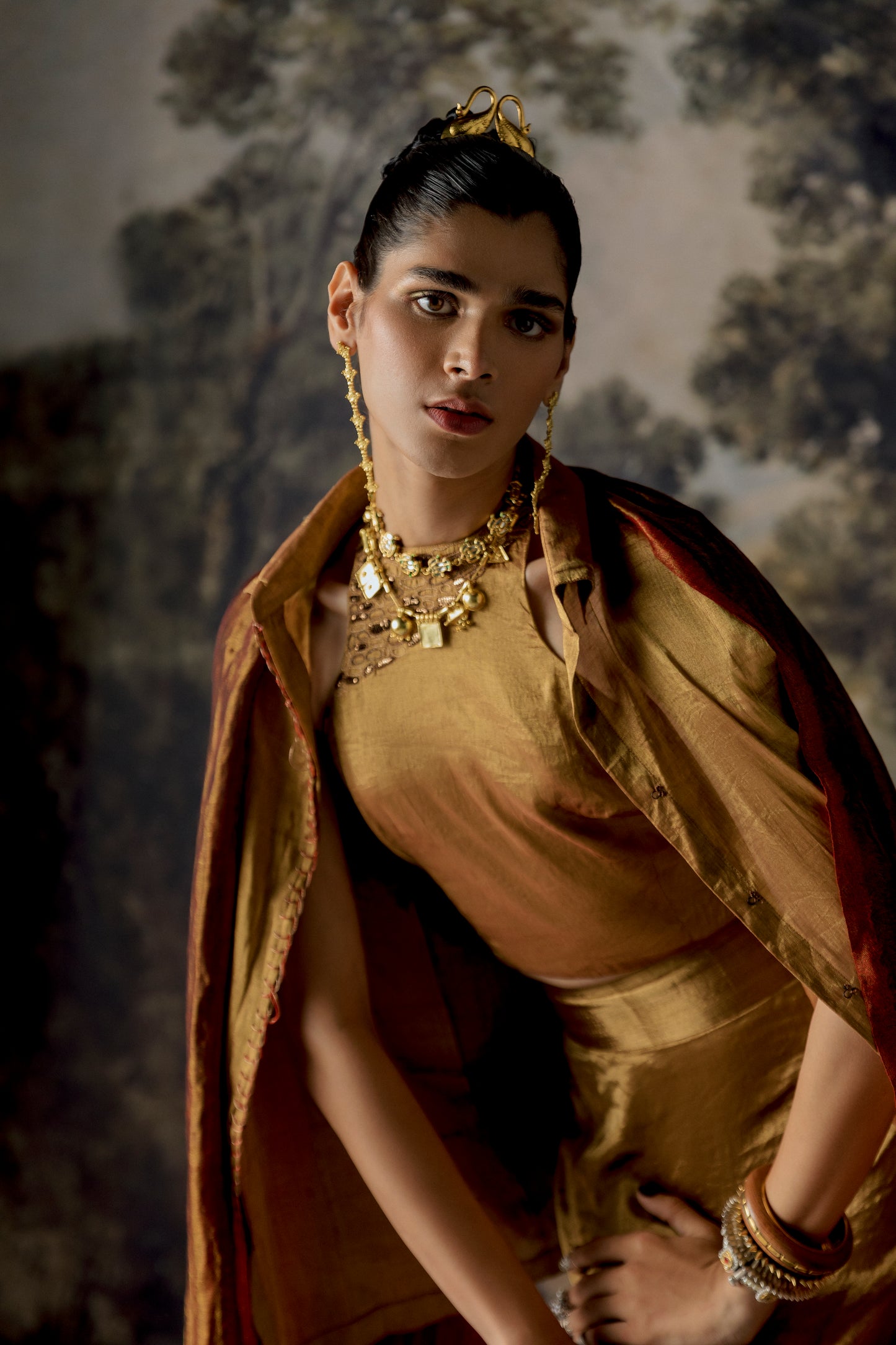 Model wearing the Exquisite Lehenga Set from the front, showcasing the elegant combination of shirt, blouse, skirt, and stole