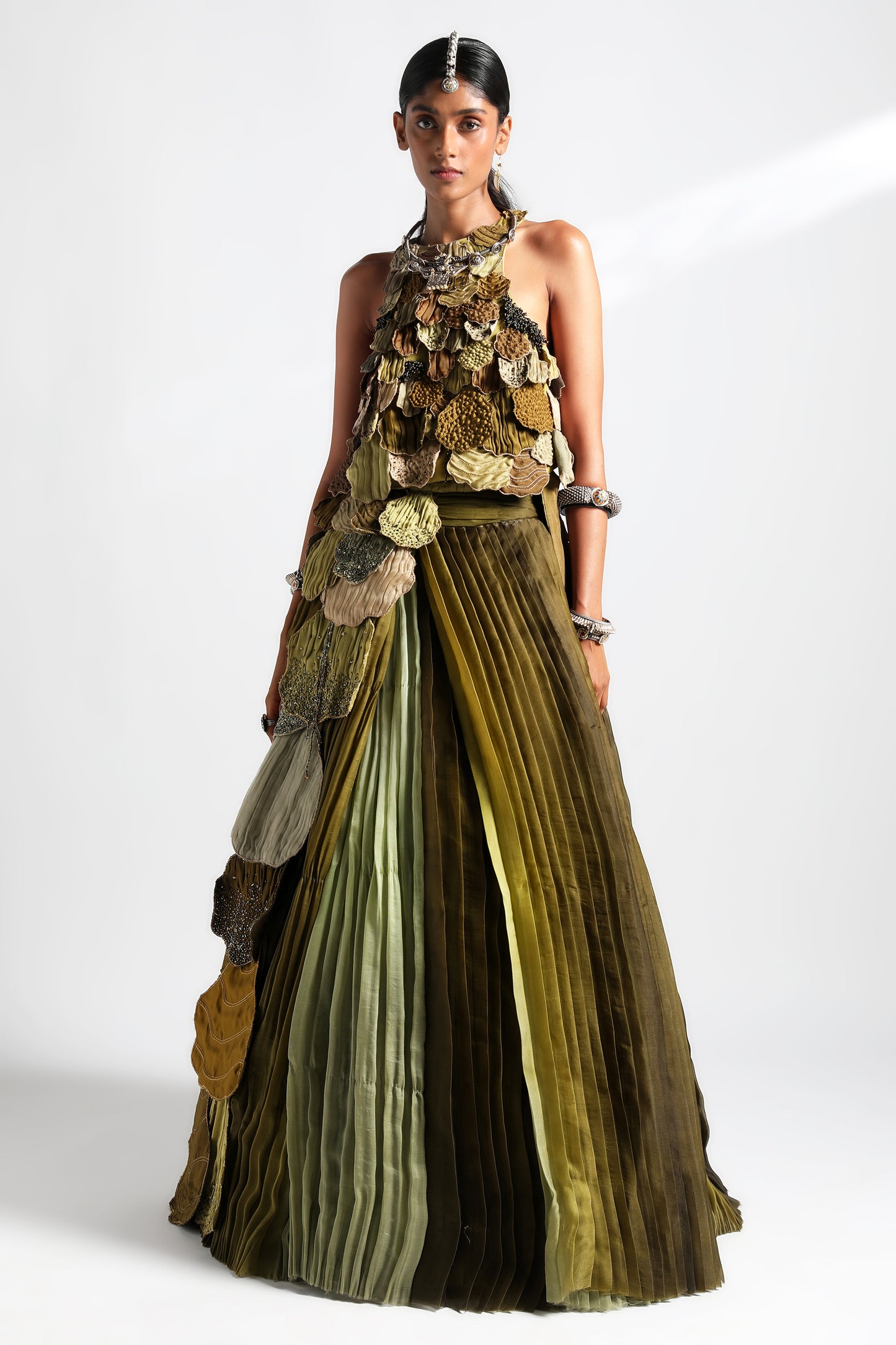 Full view of the lehenga set for women with dual-hued pleats and intricate leaf belt