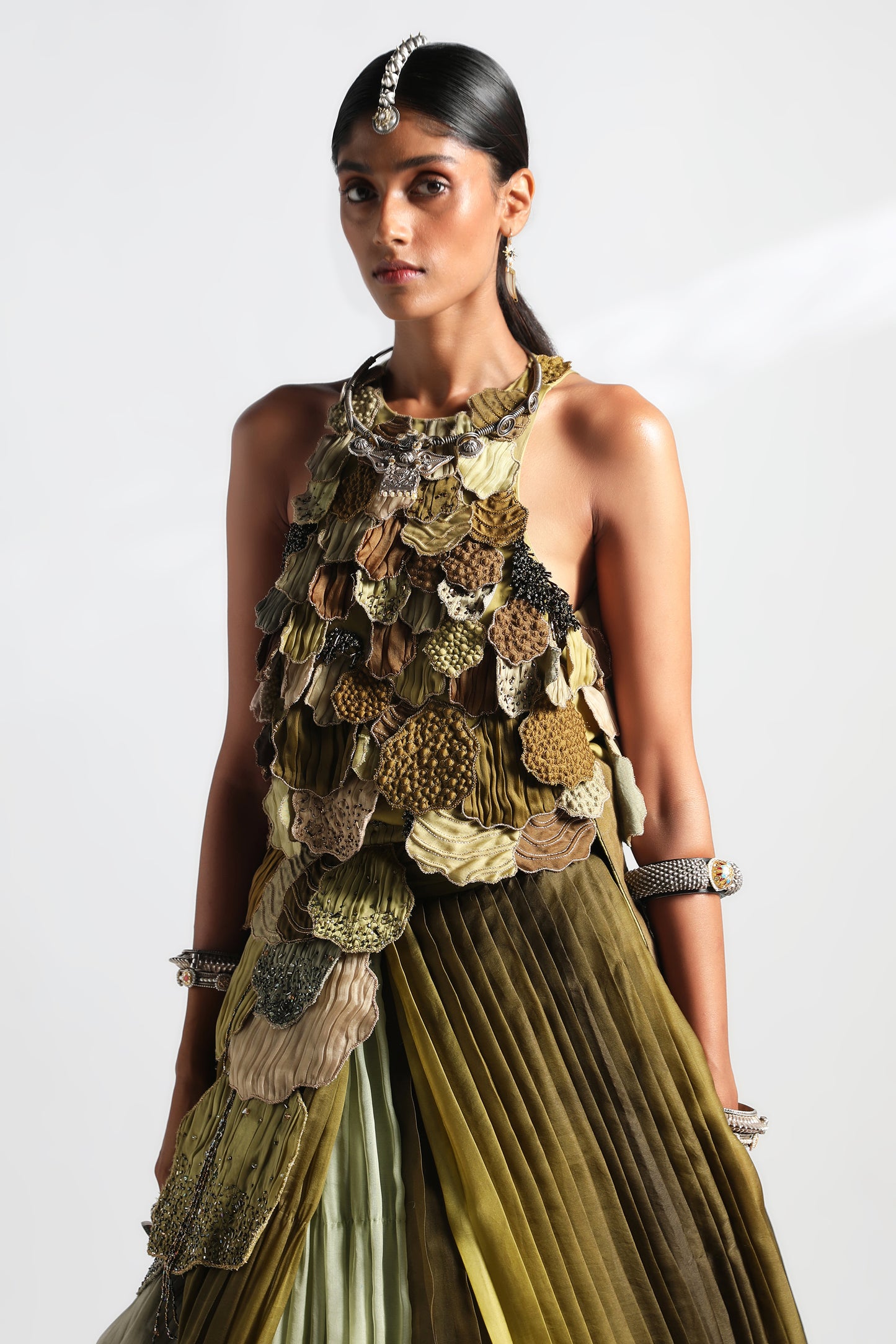 Close-up view of 3D embroidered leaves on the blouse and lehenga set for women