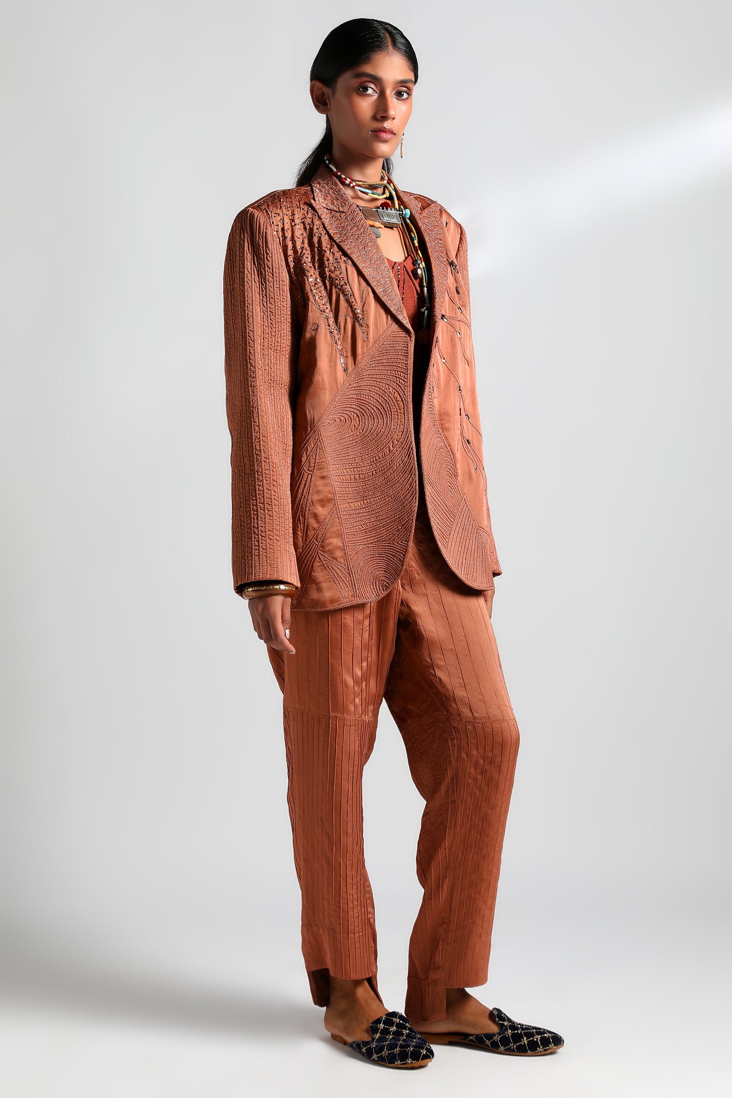 Elegant Jaisalmer suit set featuring textured jacket, embroidered corset, and pintuck trousers for women