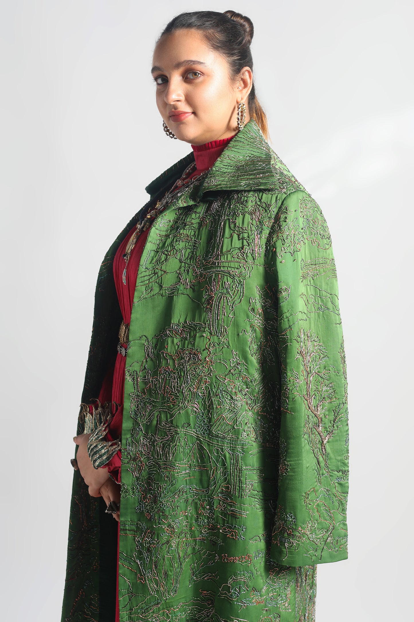 Side view of the Valdivian Robe Coat with zardosi embroidery worn over the Rumi Pink Gown
