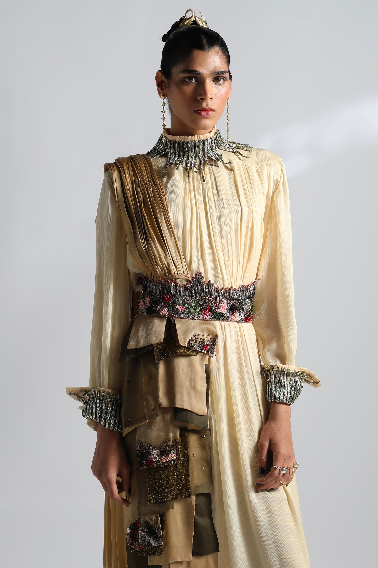 Close-up of the dual-tone metallic embroidery and textured details on the Rumi Gown with dupatta and belt