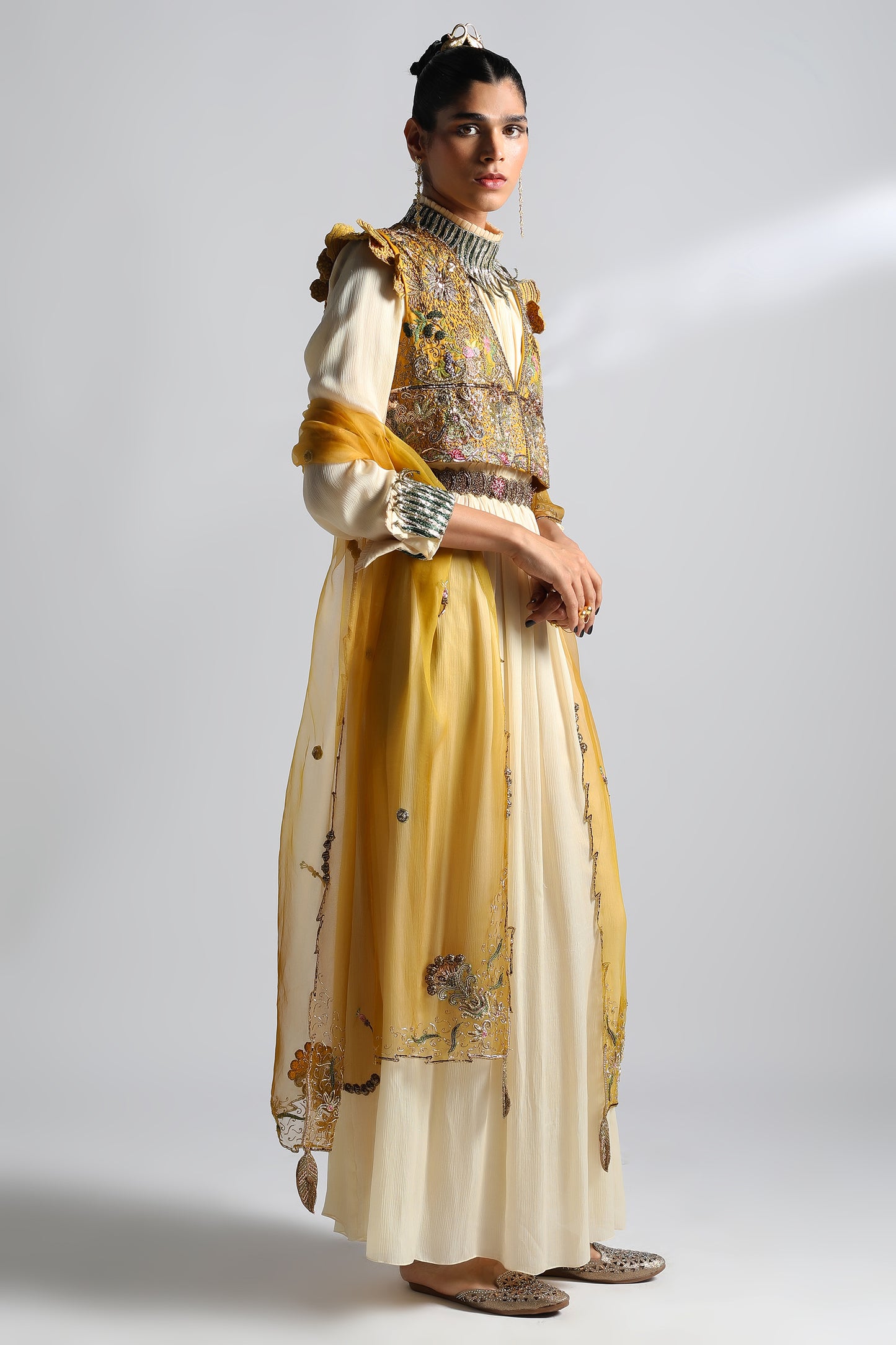 Side view of the Rumi Gown with a cropped jacket, displaying the silhouette and detailed embroidery