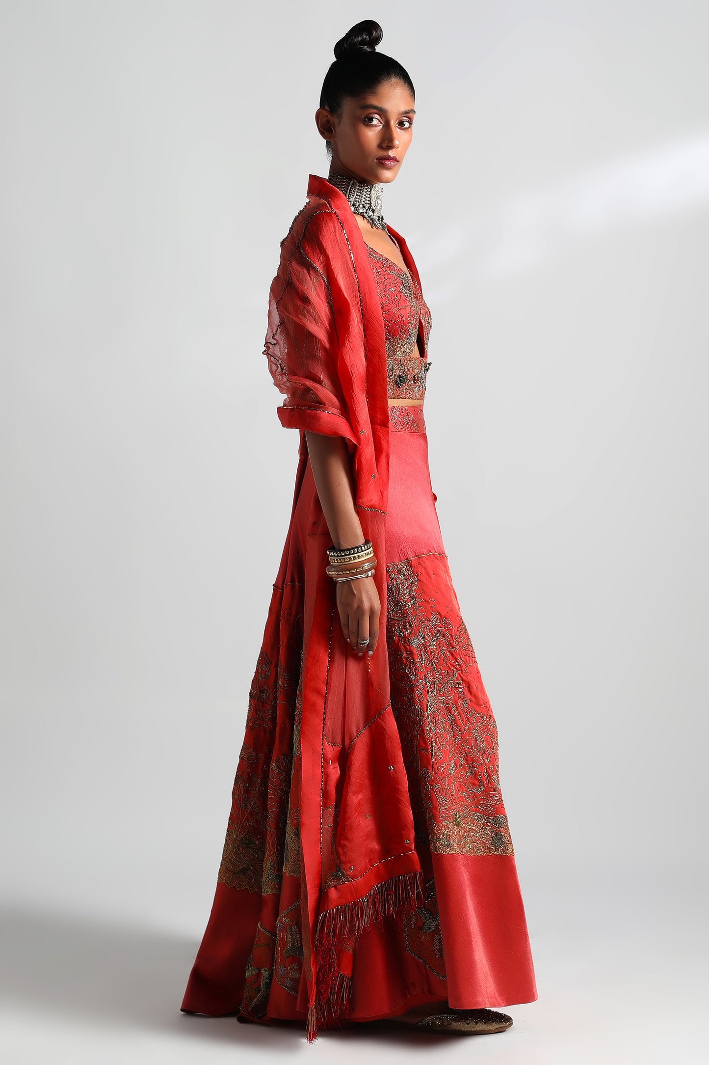 Side view of the Valdivian Lehenga and Dupatta Set with Cutout Blouse, focusing on the silhouette and threadwork details