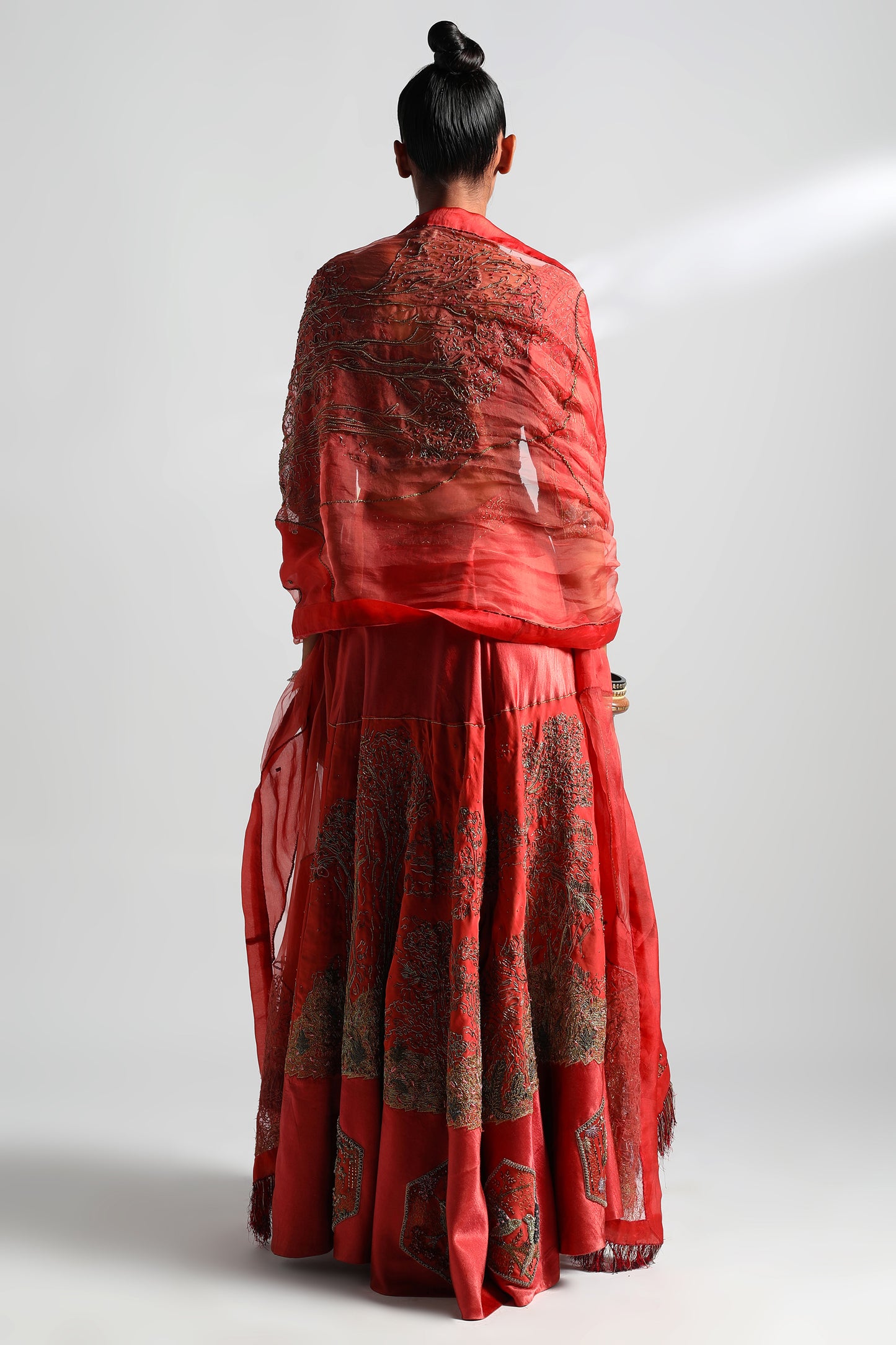 Back view of the Valdivian Lehenga Set with Cutout Blouse, showcasing the embroidery and cutout design