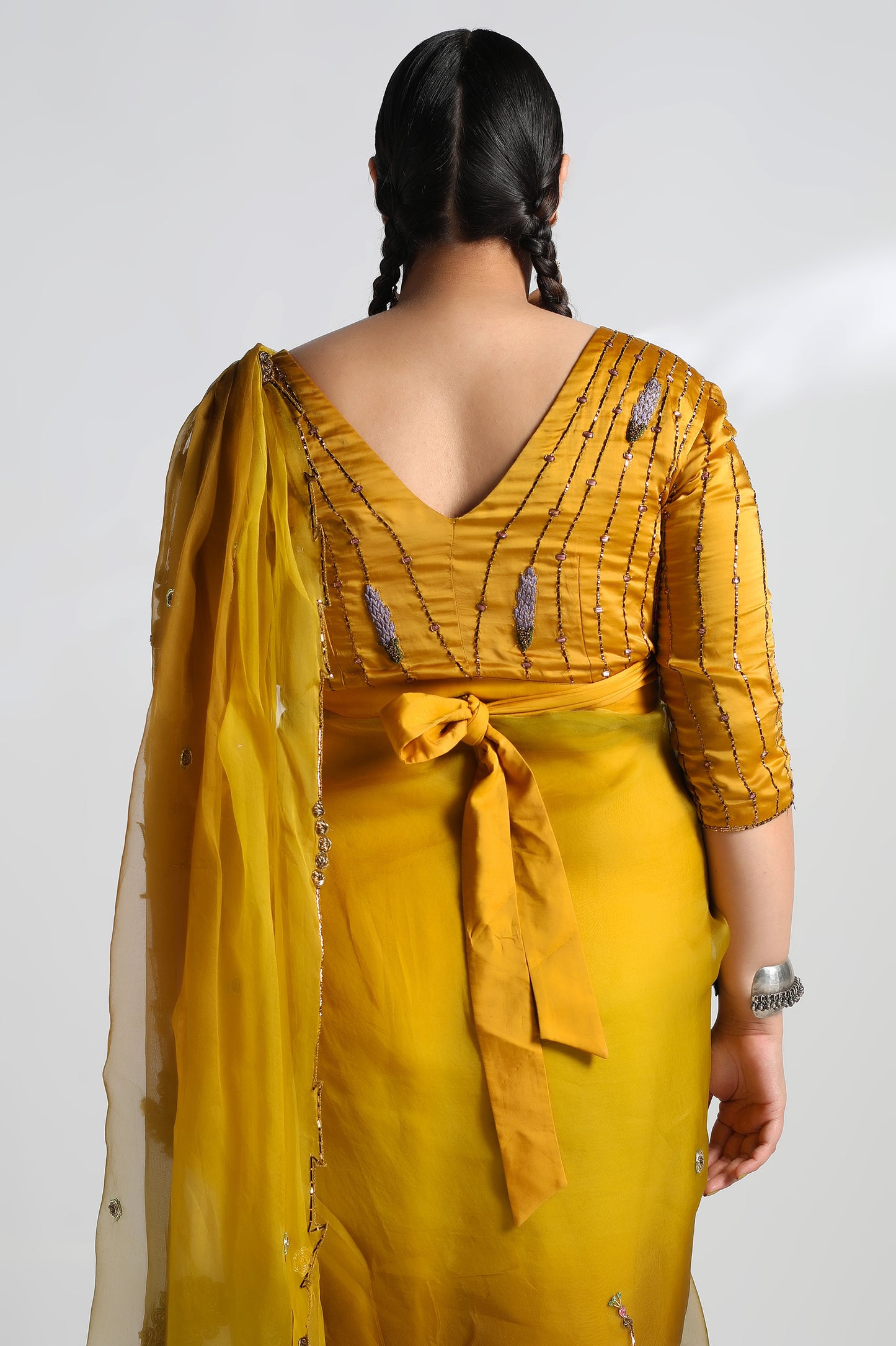 Back view of the Paro Sari with Jacket, showing the intricate floral motifs and Mukaish work