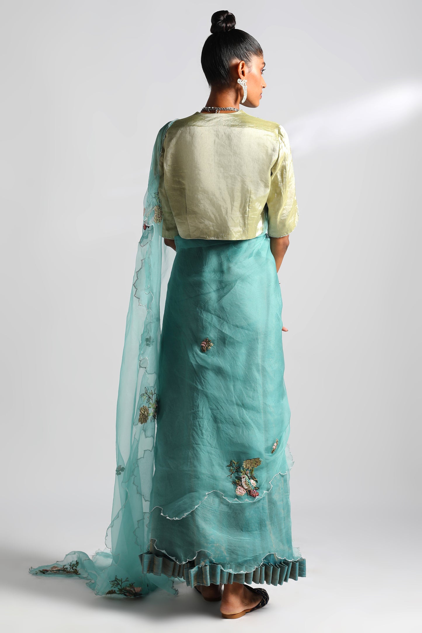 Back view of saree set featuring Chanderi tissue blouse with hummingbird border
