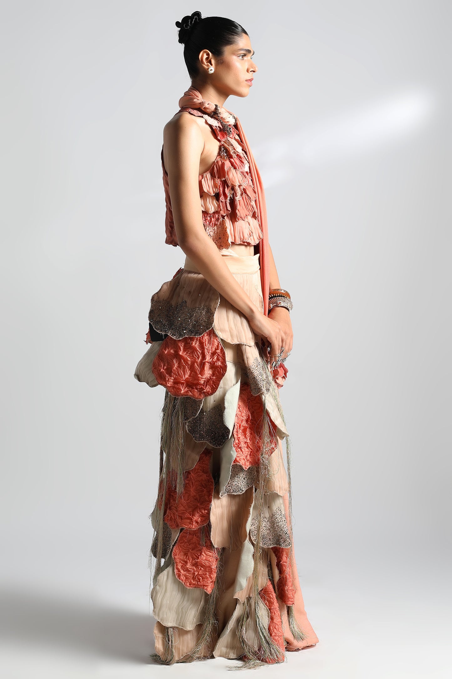 Side view of saree and blouse set featuring belted blouse with leaf belt design
