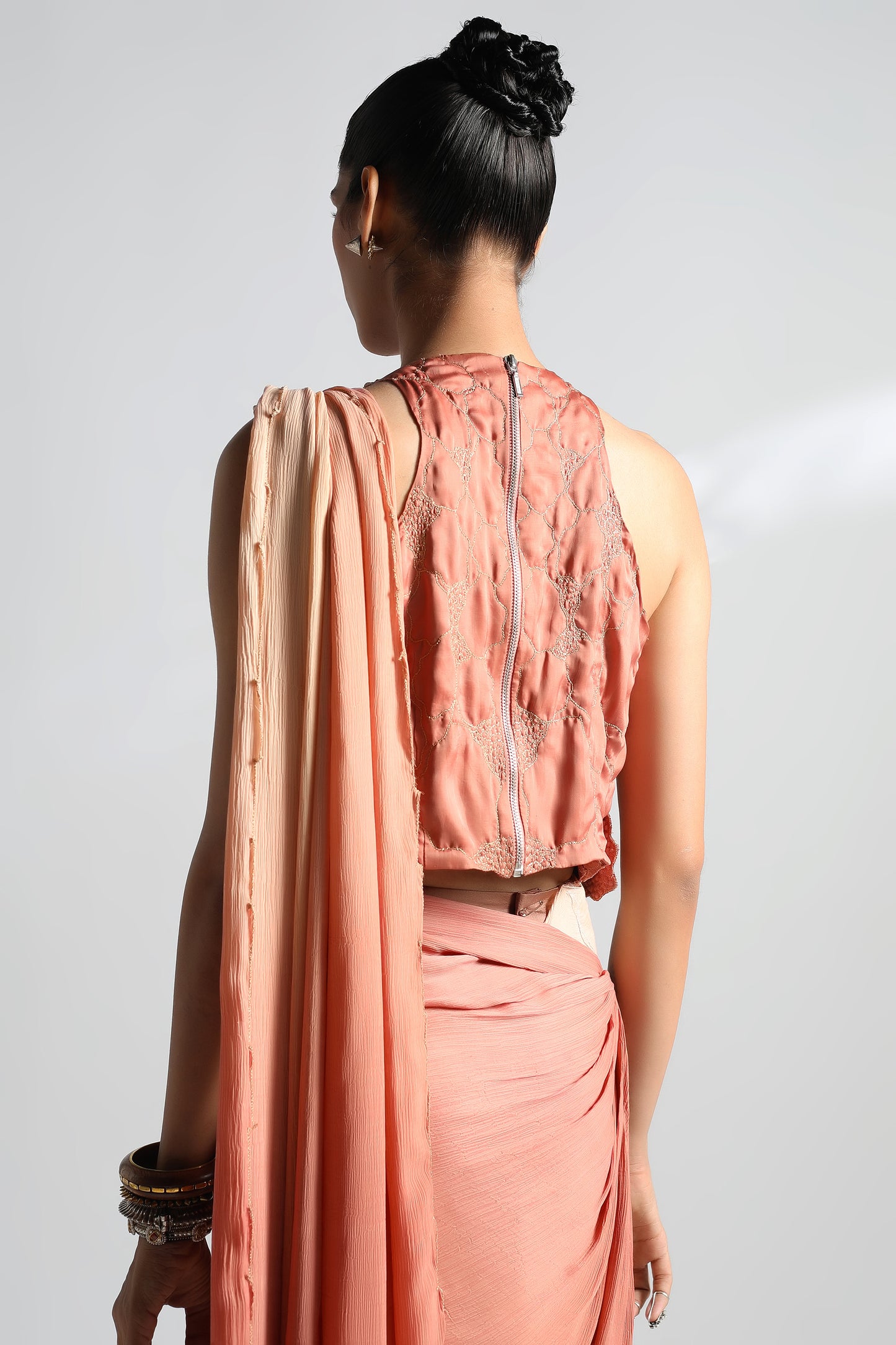 Close-up of the back design of Mima Mounds top saree set with sari draping