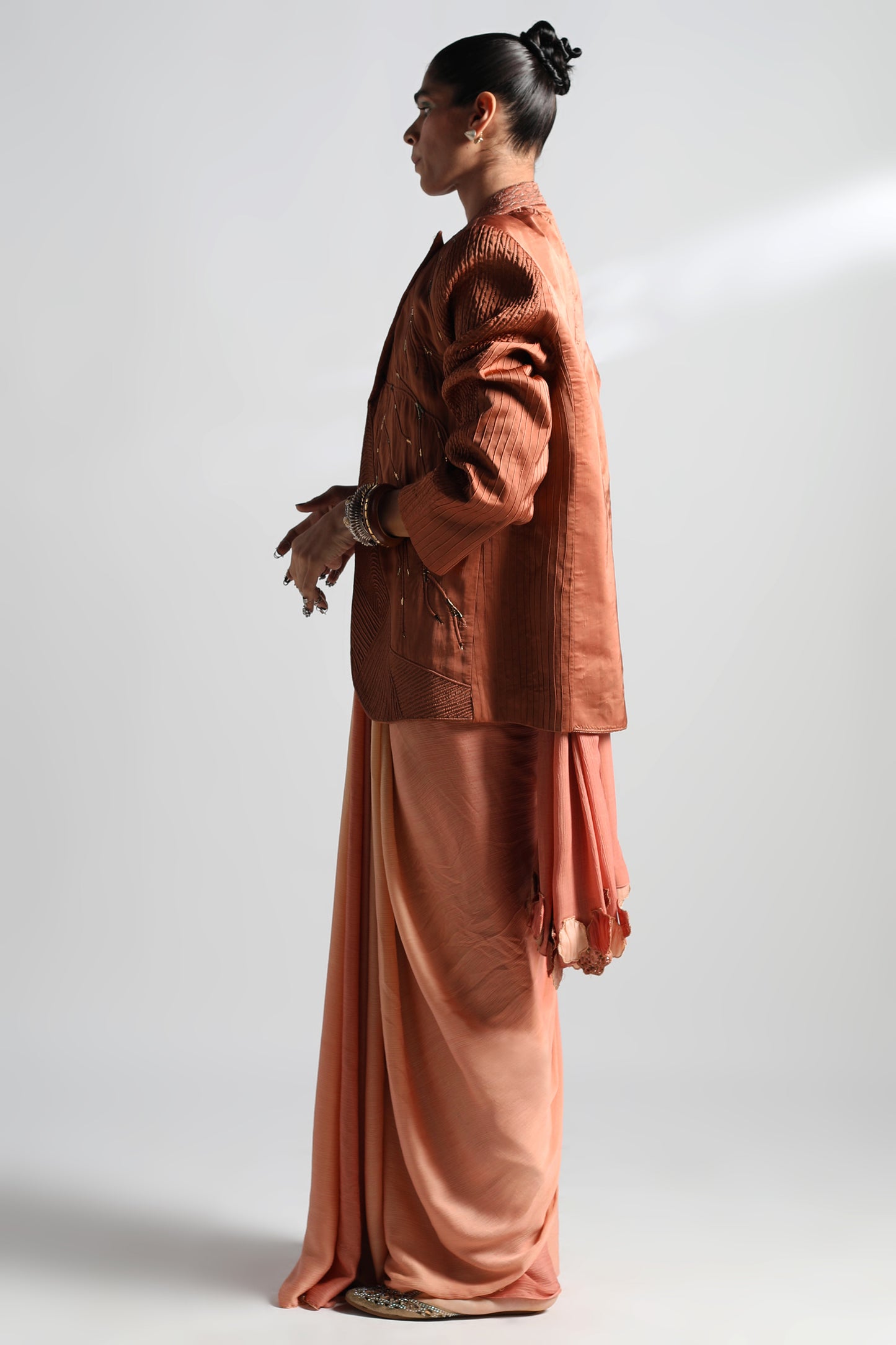 Side view of top saree with Mima Mounds blouse and Jaisalmer jacket featuring Mukaish work