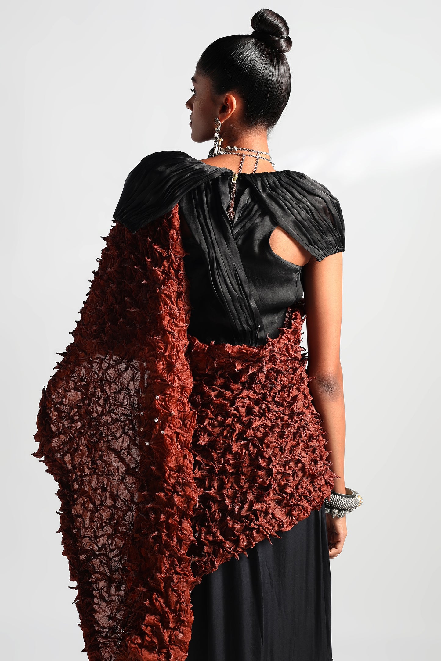 Back view of Wind crop top and skirt set showcasing stole and skirt draping