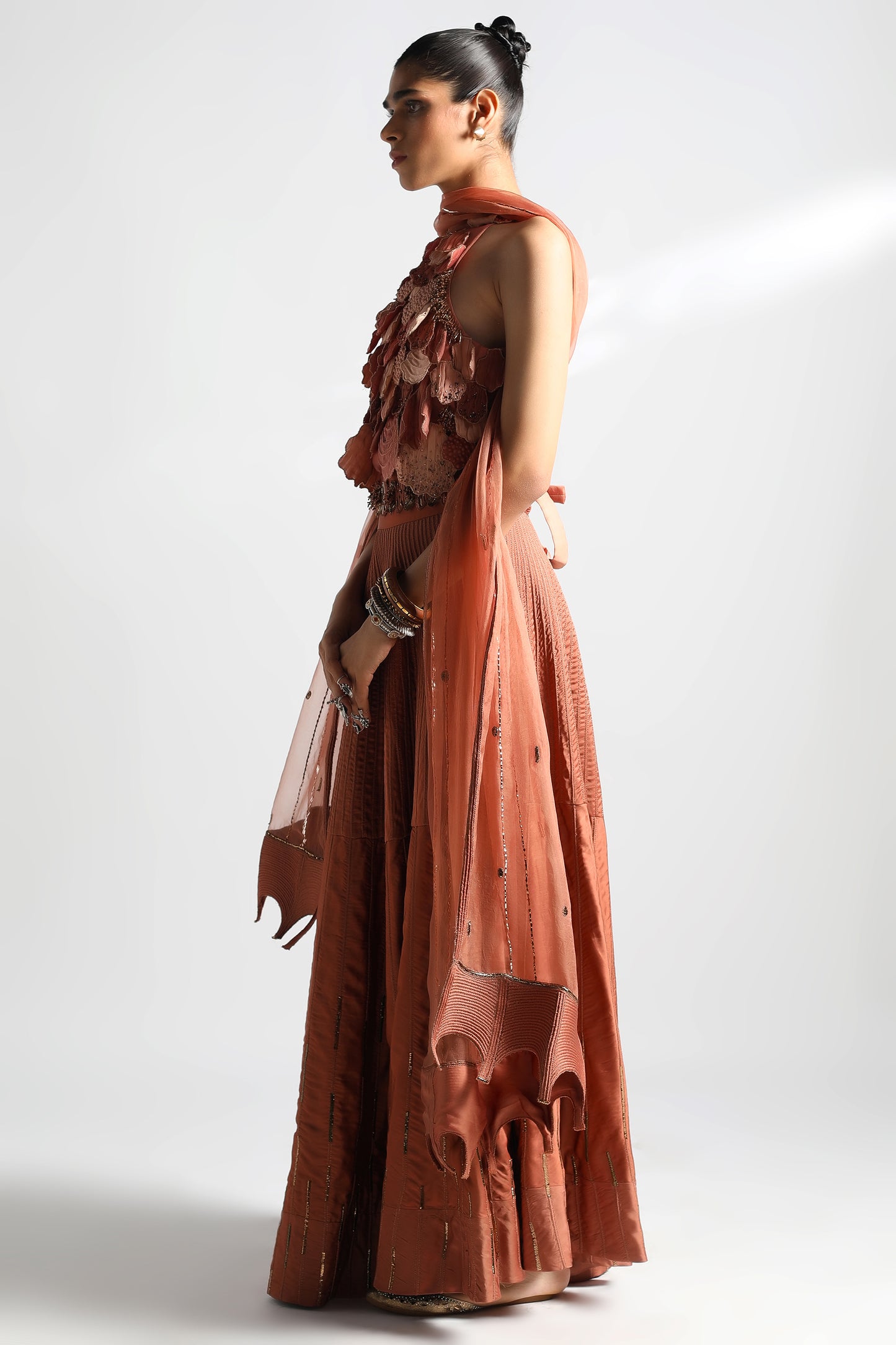 Side view of top lehenga set with Jaisalmer dori work lehenga and Mukaish dupatta