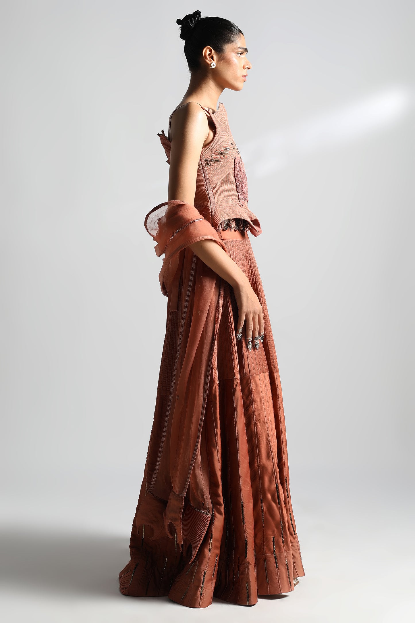 Side view of corset lehenga with detailed dori work and Mukaish embellishments