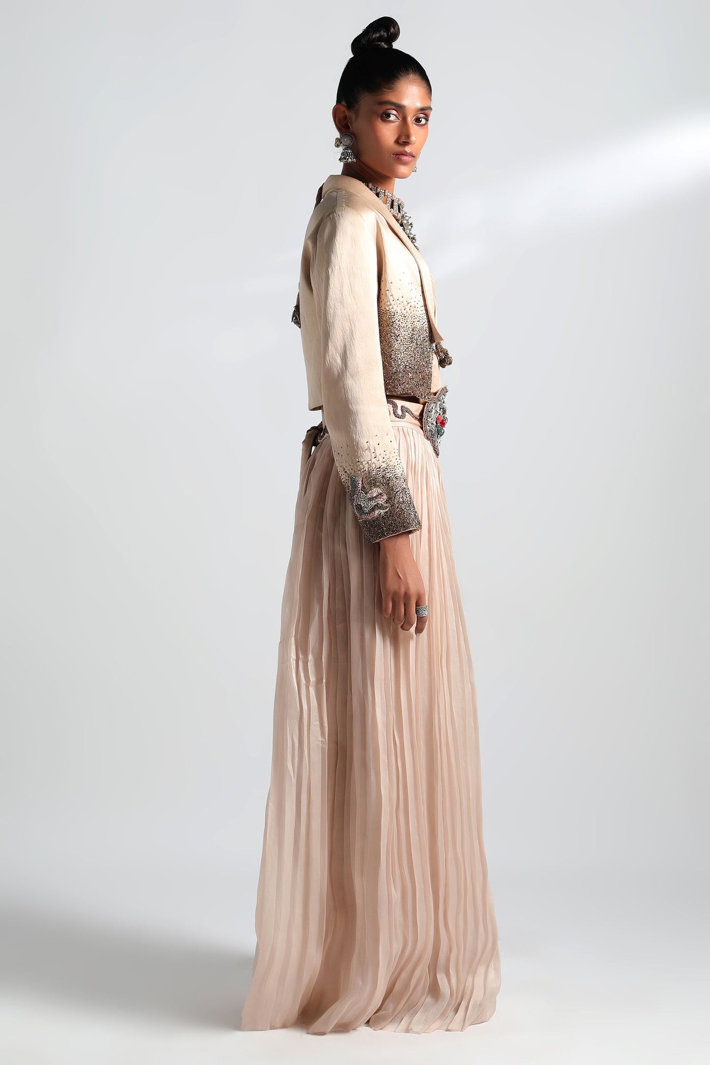 Side view of Nargis corset lehenga with pleated skirt and embroidered jacket