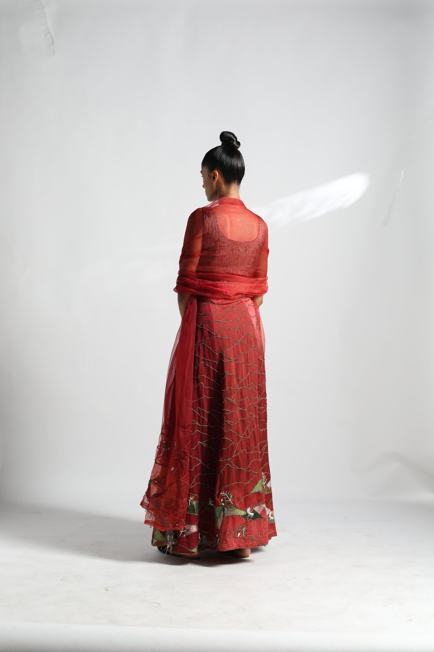 Back view of Namib lehenga and dupatta set showing detailed draping and blouse design