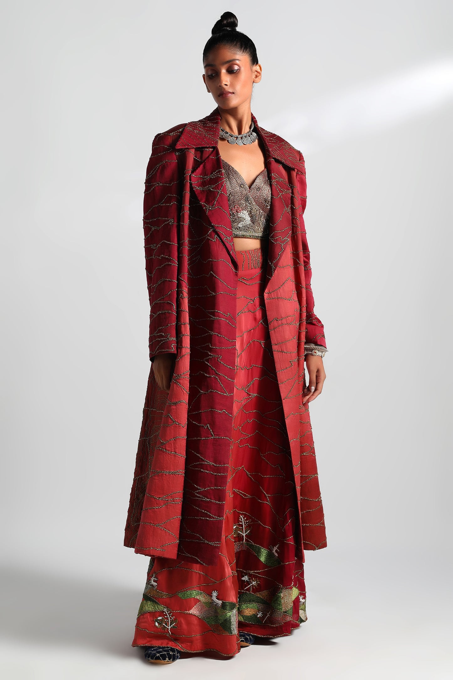Namib sherwani overcoat with lehenga, metallic blouse, and dupatta featuring hand embroidery