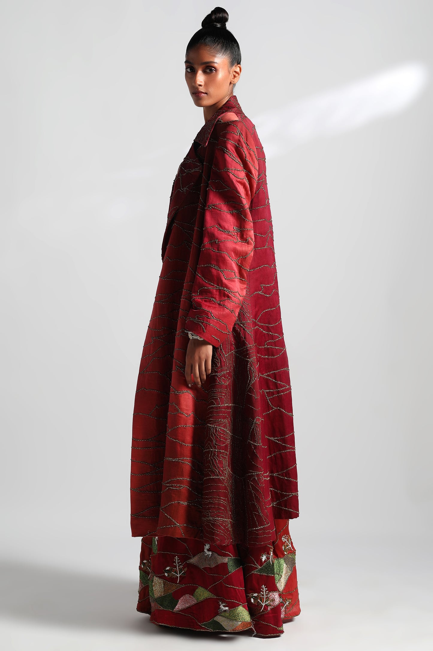 Side view of Namib sherwani overcoat with lehenga, metallic blouse, and dupatta