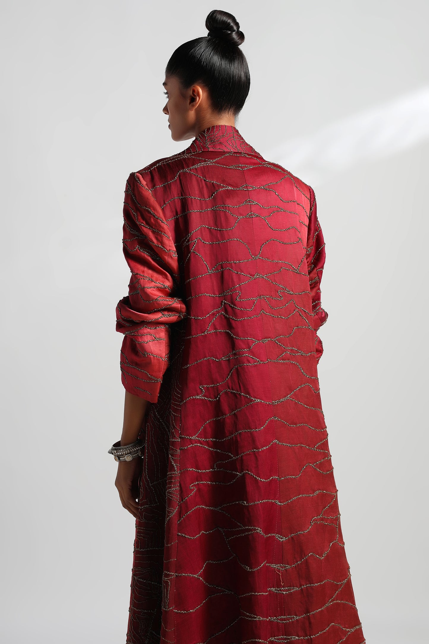Close-up of fabric texture and hand embroidery on Namib sherwani overcoat