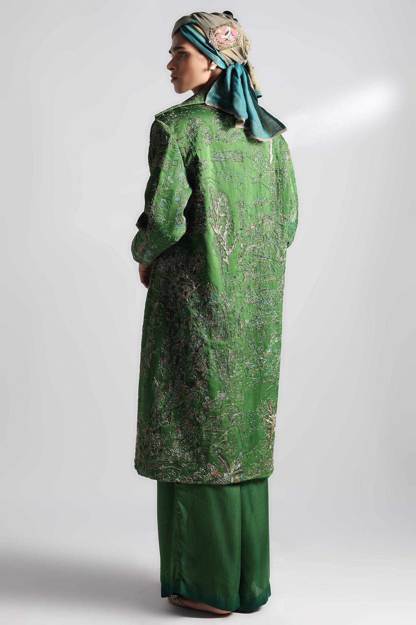 Back view of Valdivian corset top and trousers set showing detailed metallic embroidery