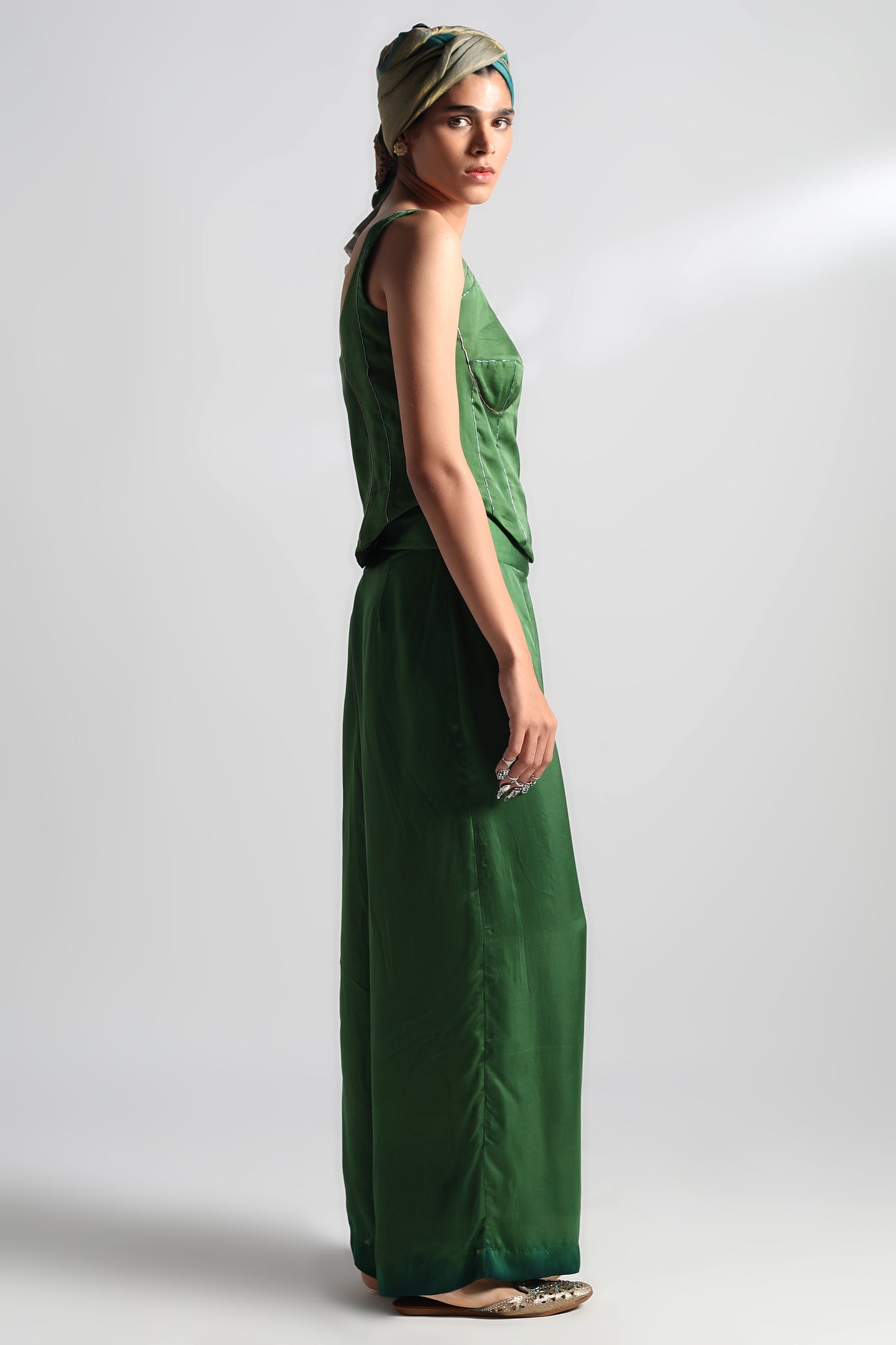 Side view of Valdivian corset top and women’s trousers co-ord set showcasing the satin fabric