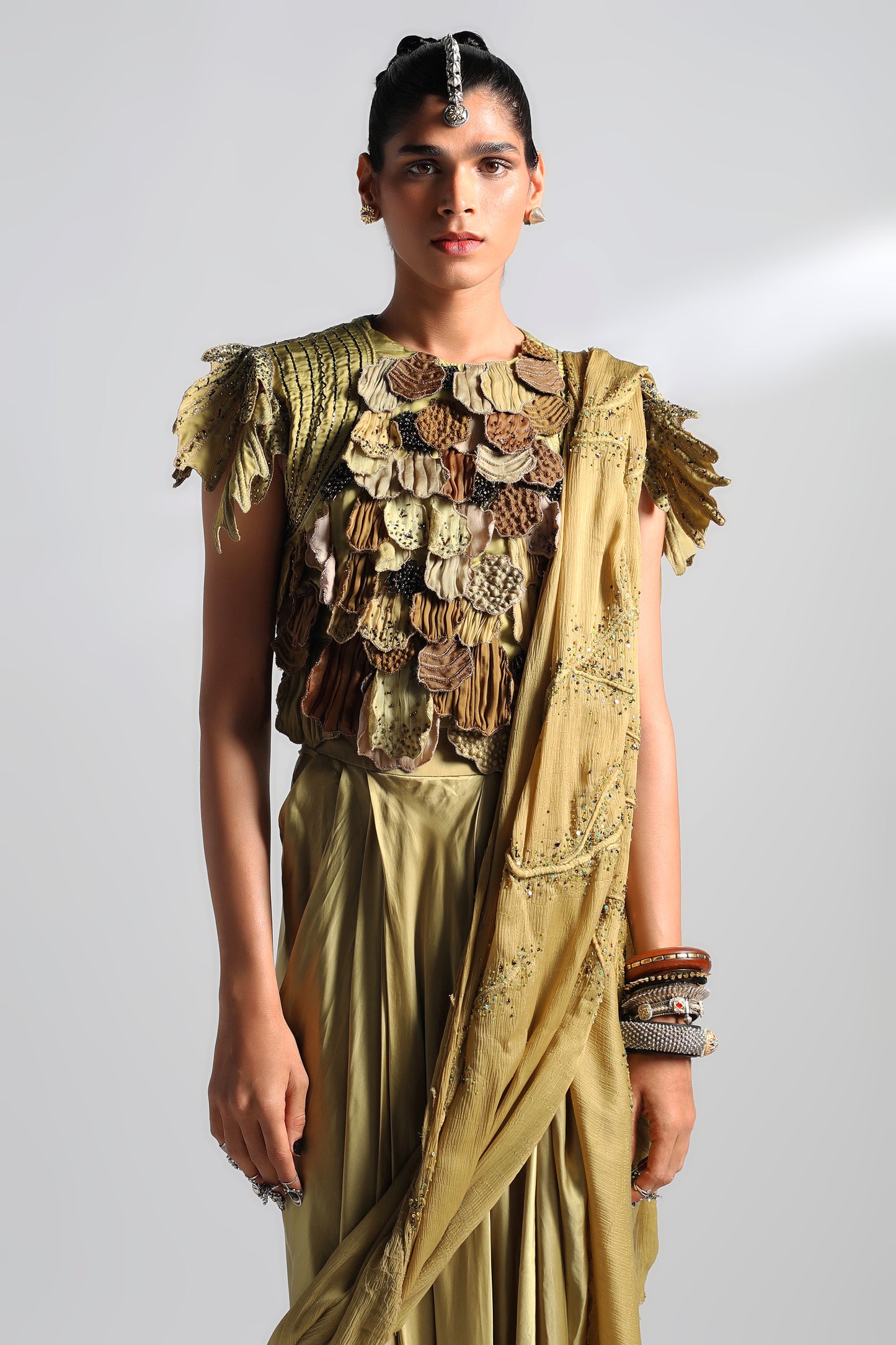 Close-up of leaf patchwork and hand beading on Mima Mounds skirt and top set