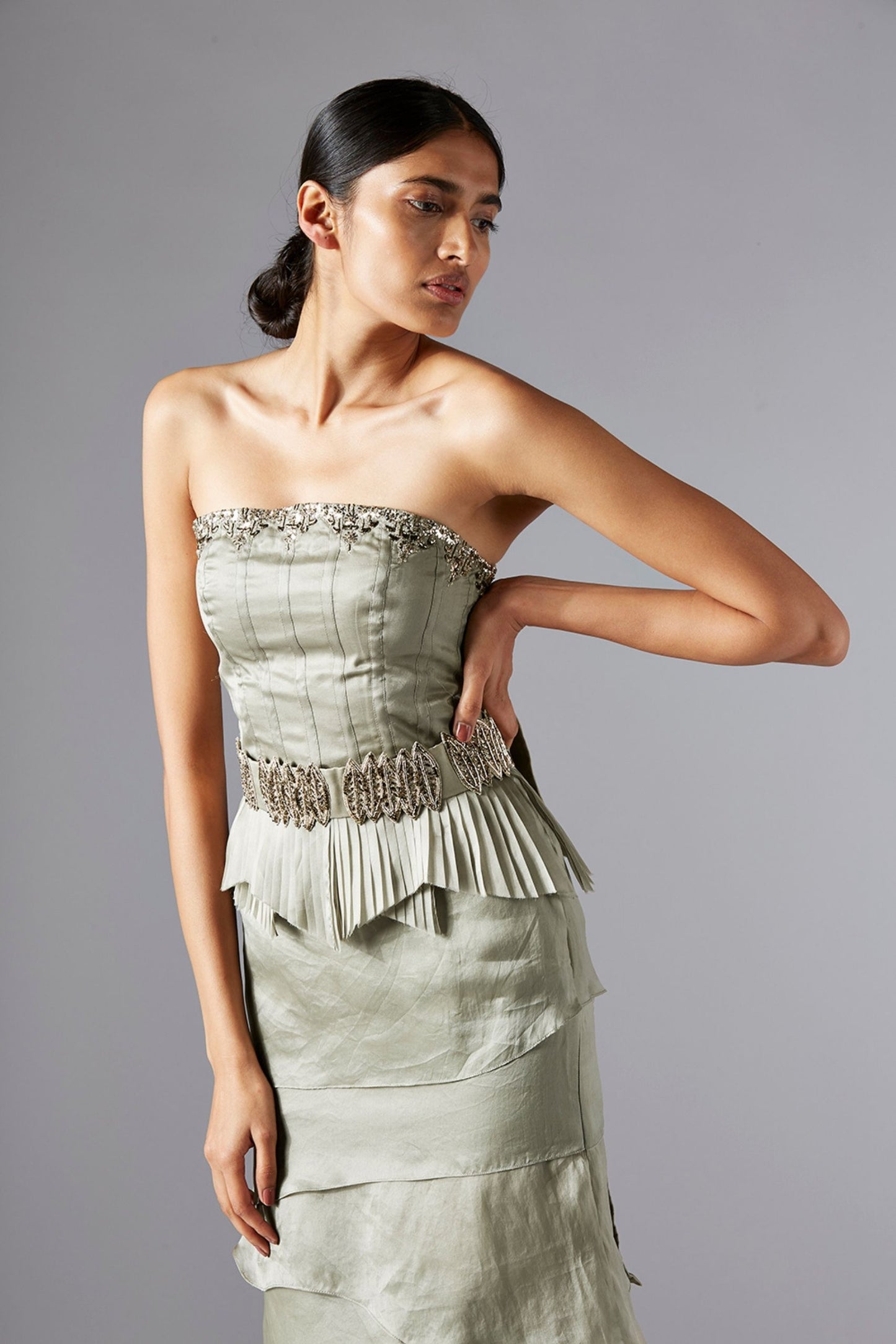 Close-up of the corset detailing and pleated layers of the corset and skirt set in satin organza