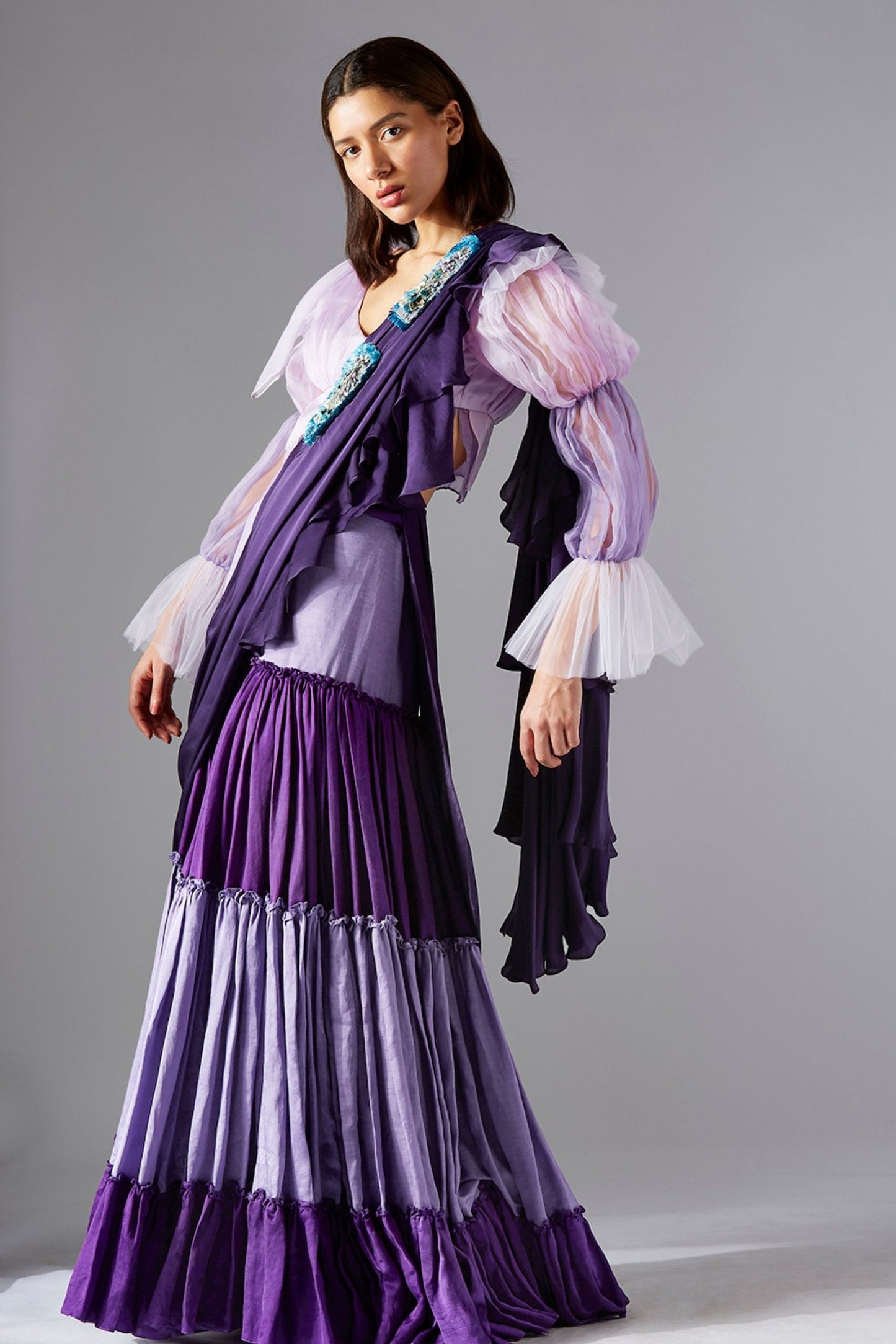 Model wearing the blouse and sharara dress with 2-tone gharara and embroidered dupatta, exuding elegance and luxury