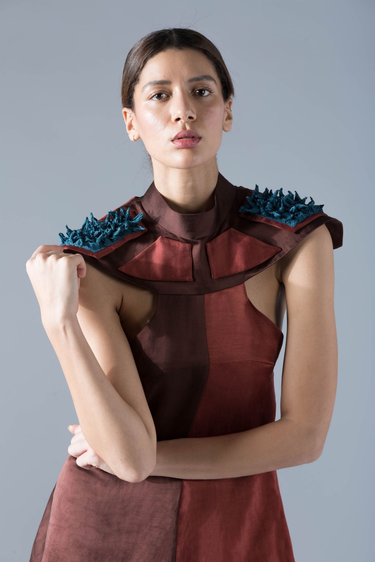 Close-up of the bold design details and luxurious fabric of the modern shoulder tent dress for women