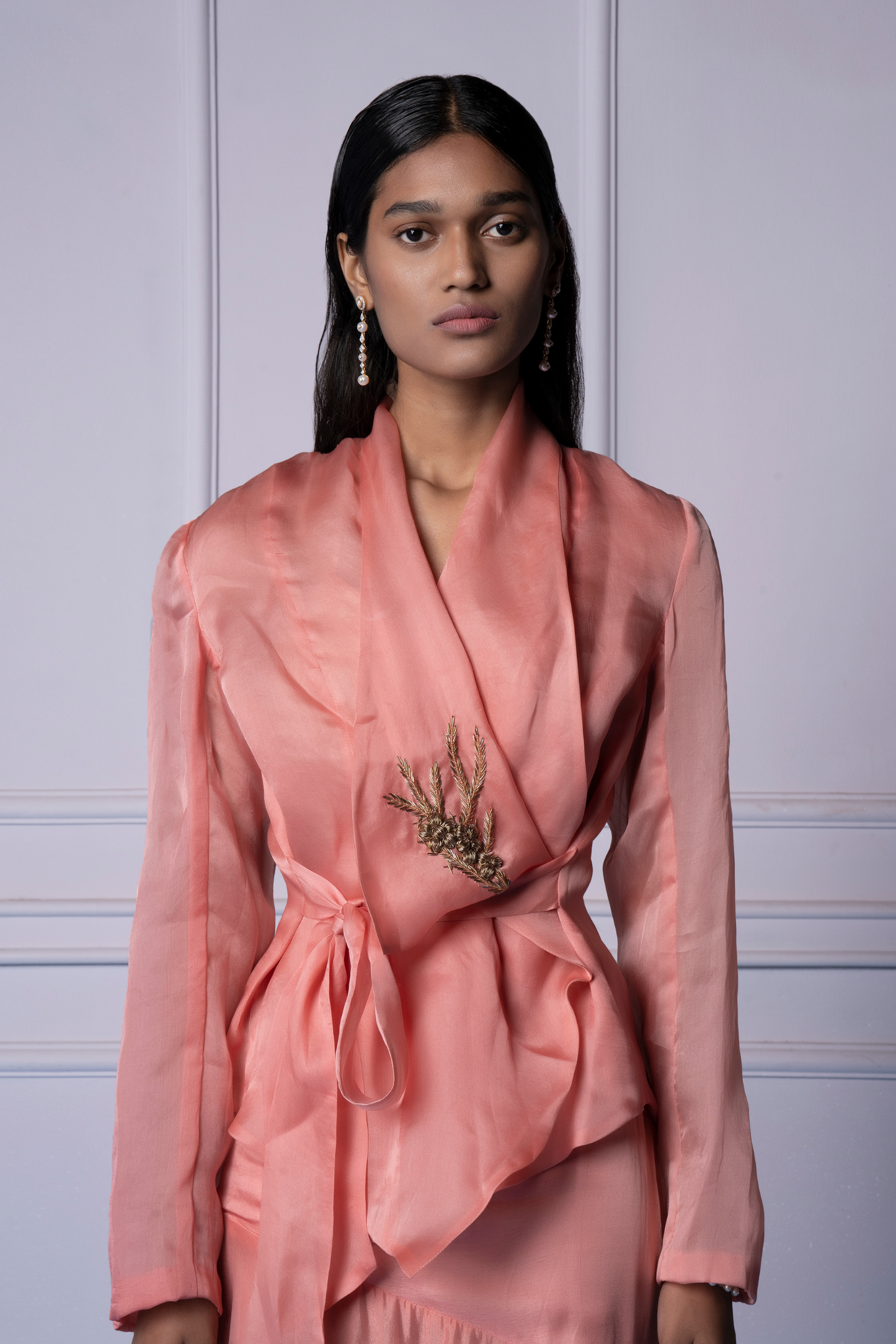 Close-up of metallic embroidery on the iconic pink jacket