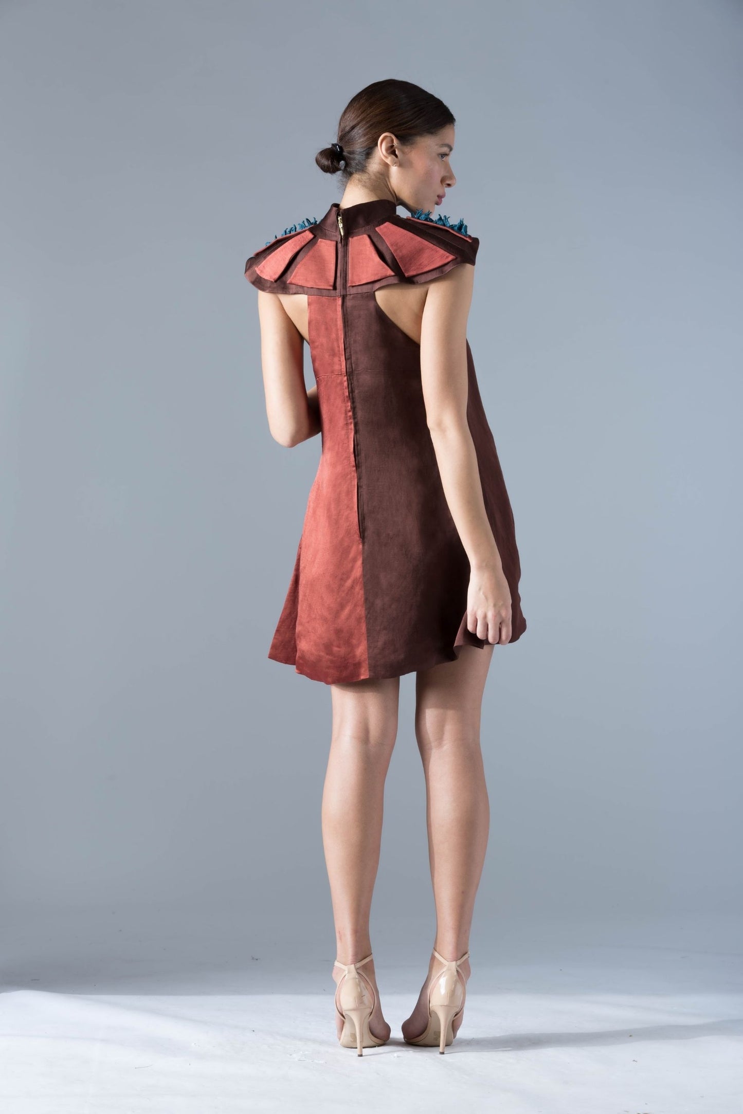 Back view of the stylish shoulder tent dress, showcasing the luxurious fabric and sleek fit