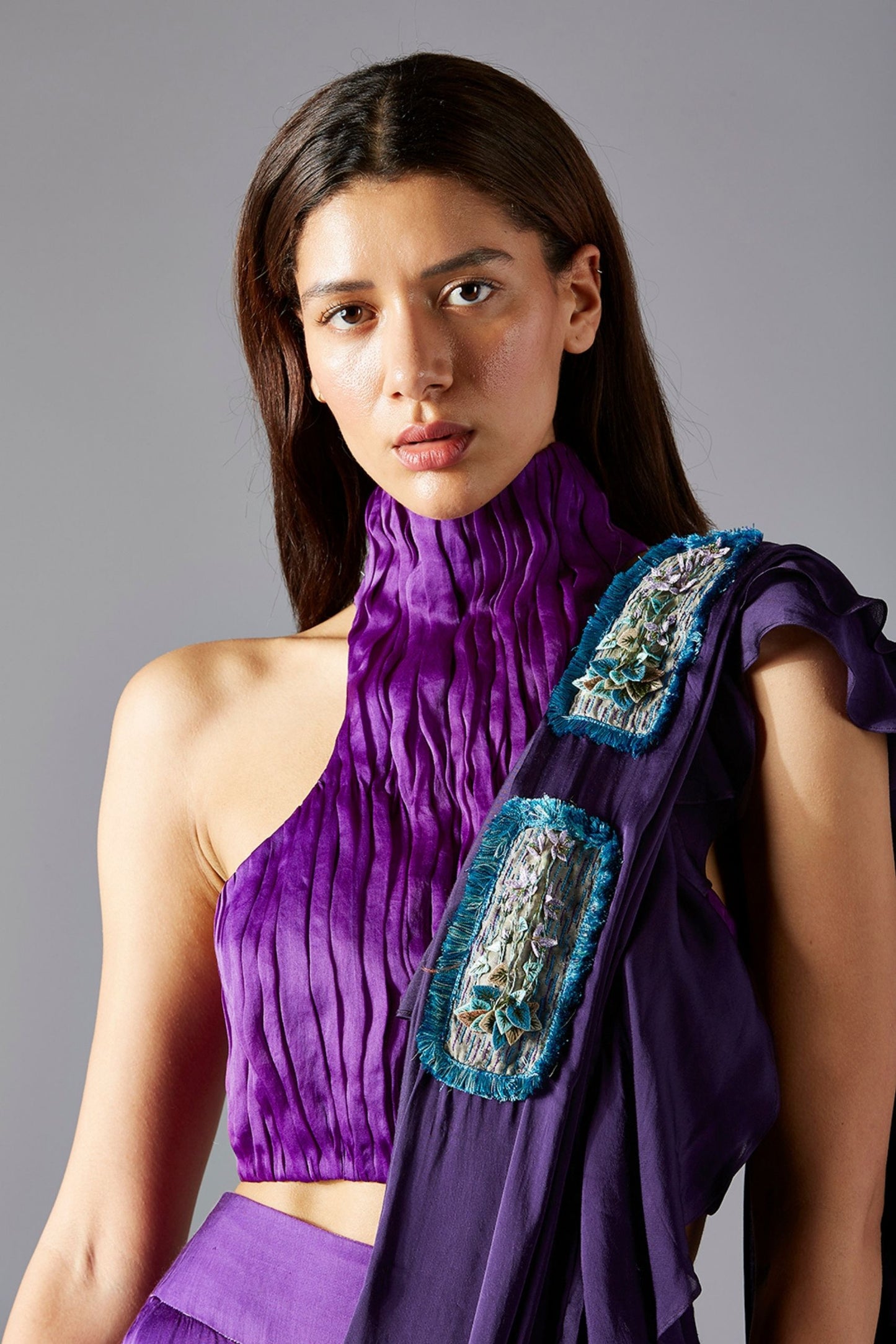 Model wearing the trendy crop top, beaded layered skirt, and dupatta set, exuding chic and modern elegance