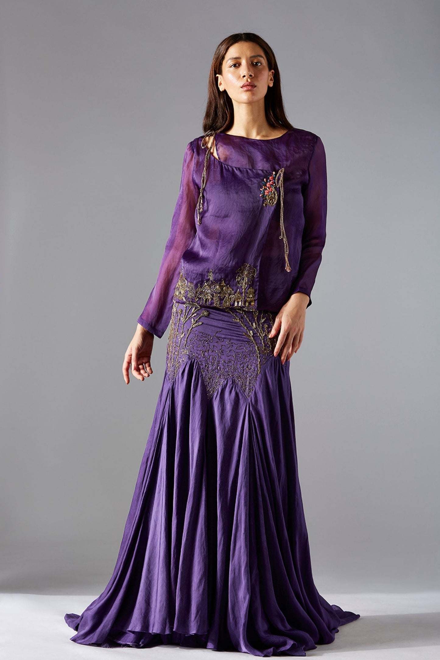 Stylish top skirt set for women featuring a corset-style top with abstract embroidery and a flared batik skirt, perfect for evening occasions