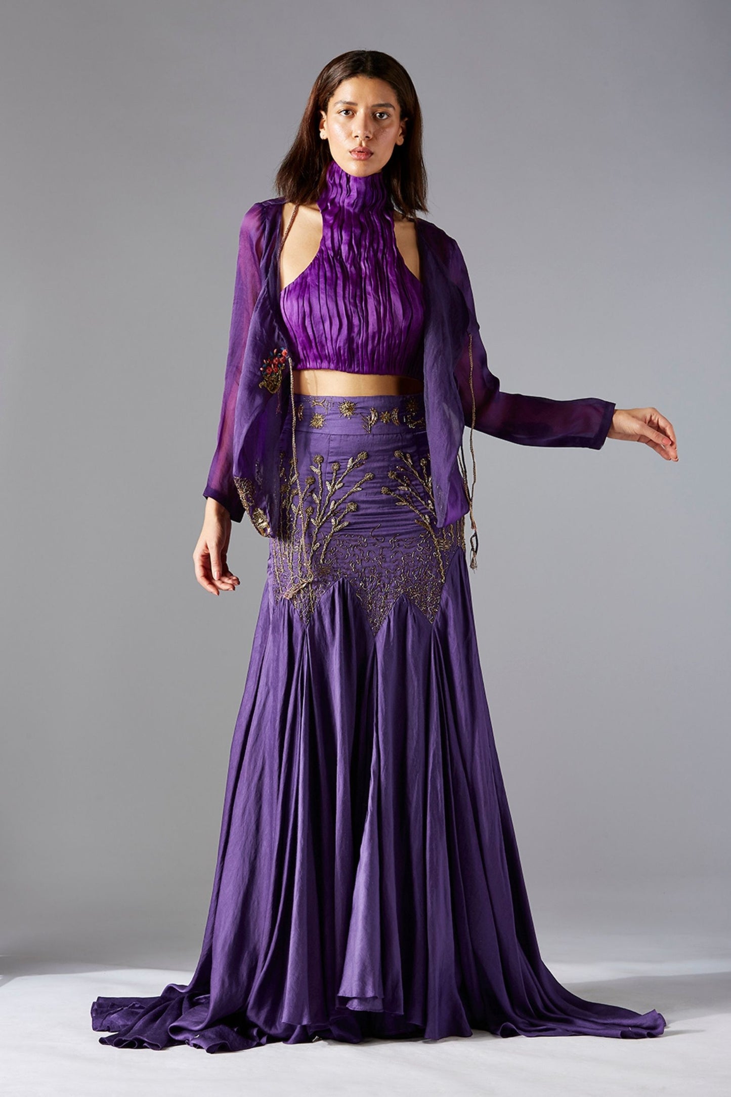 Model wearing the stylish top skirt set with corset-style top and flared batik skirt, perfect for evening occasions