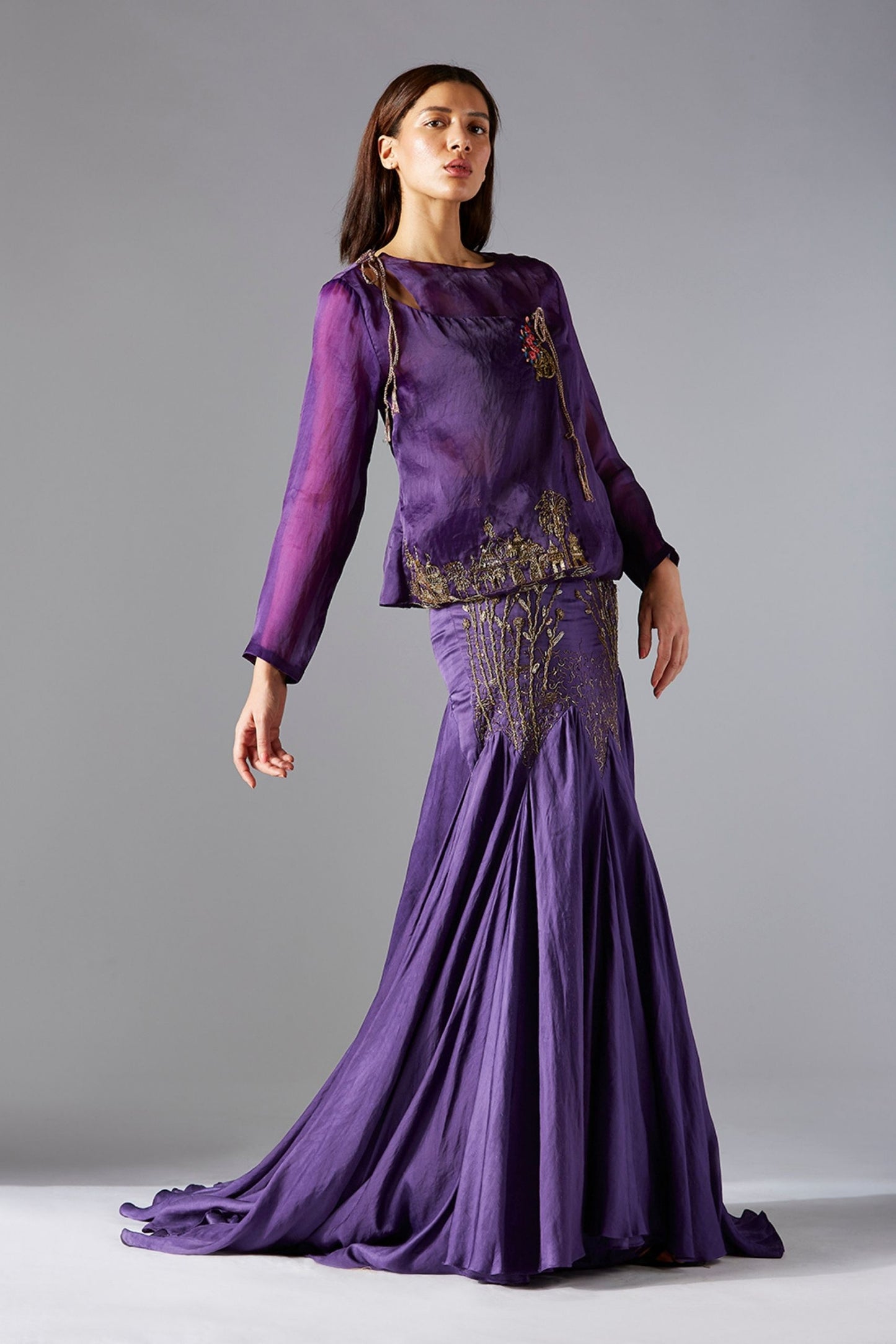 Full view of the top skirt set, featuring a corset-style top with abstract embroidery and a flared batik skirt