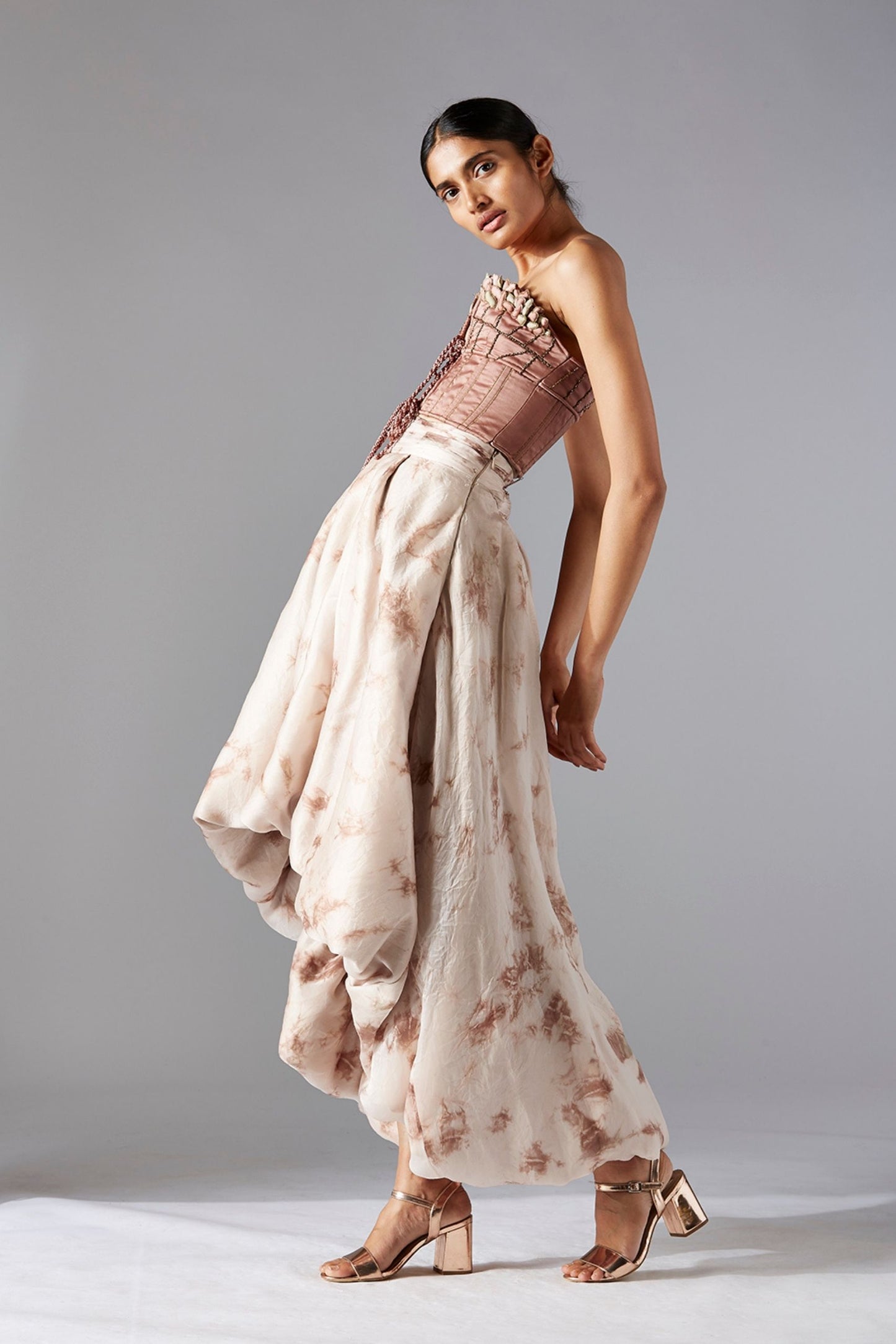 Side view of the Maze Scrawled stylish top and modern skirt set, emphasizing the flattering fit and silhouette