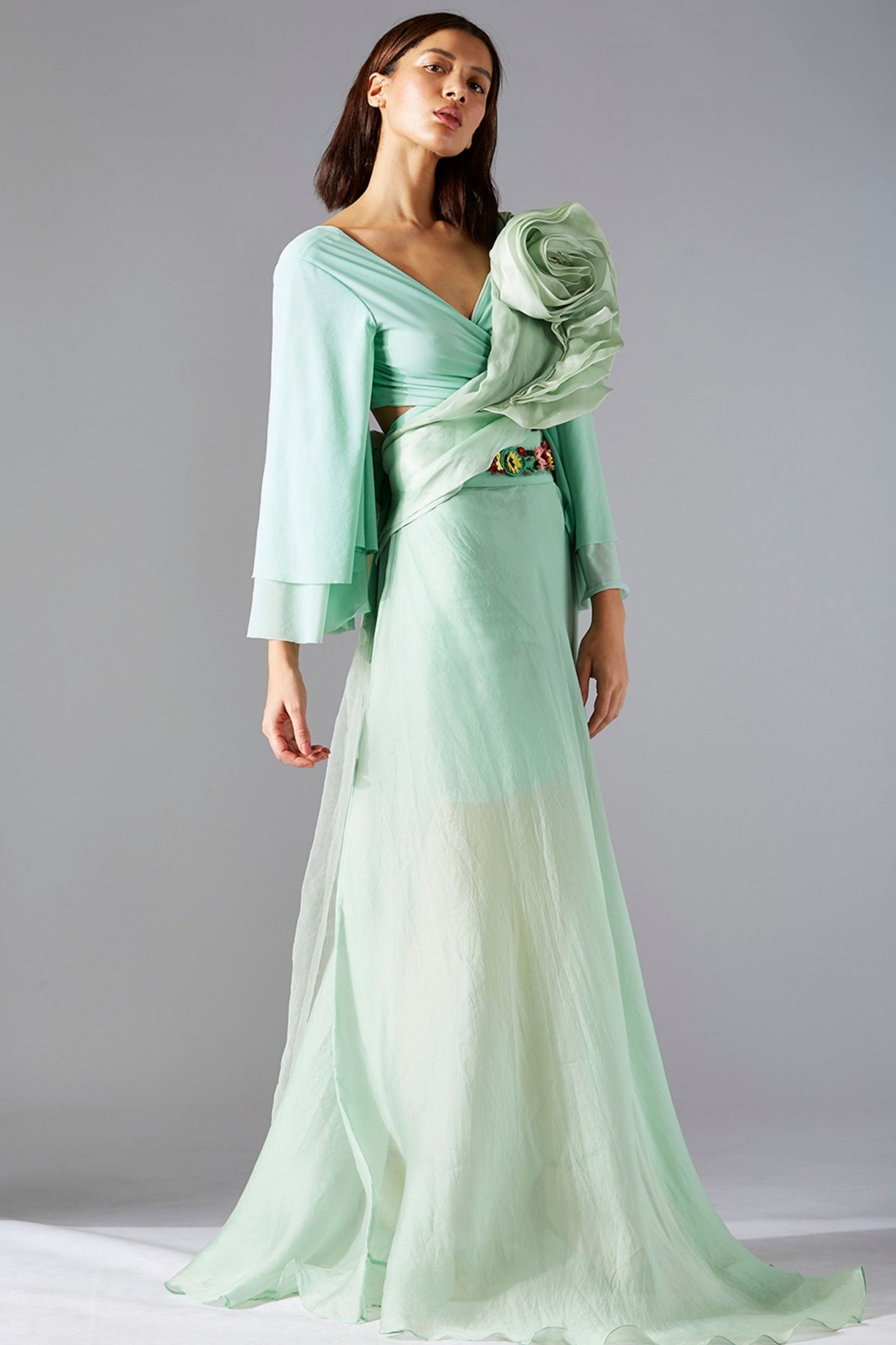 Blouse and skirt dress featuring floral embroidery and a rose stole, offering an elegant and timeless look for special occasions