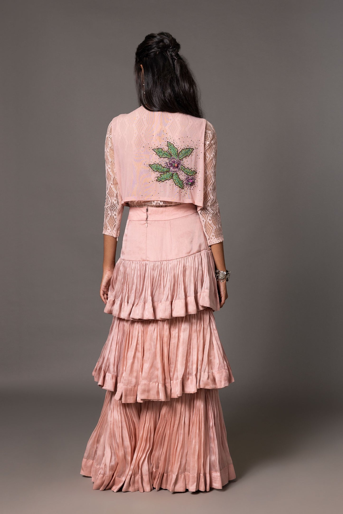 Back view of the Sang-e-Sitara Lehenga Set, highlighting the intricate embroidery of the jacket and the full flow of the layered skirt