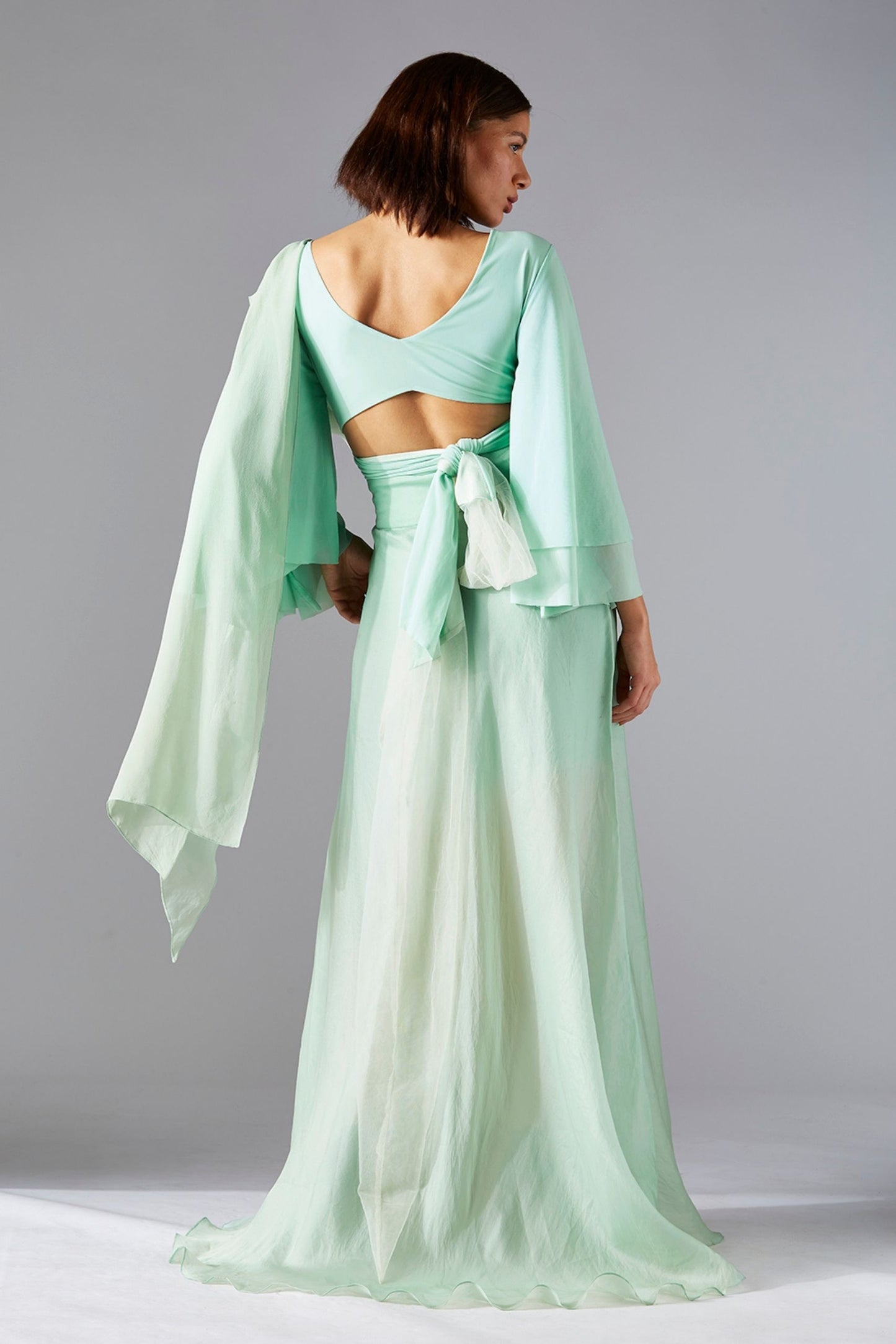 Back view of the blouse and skirt dress, showcasing the elegant rose stole and the well-fitted blouse and skirt design