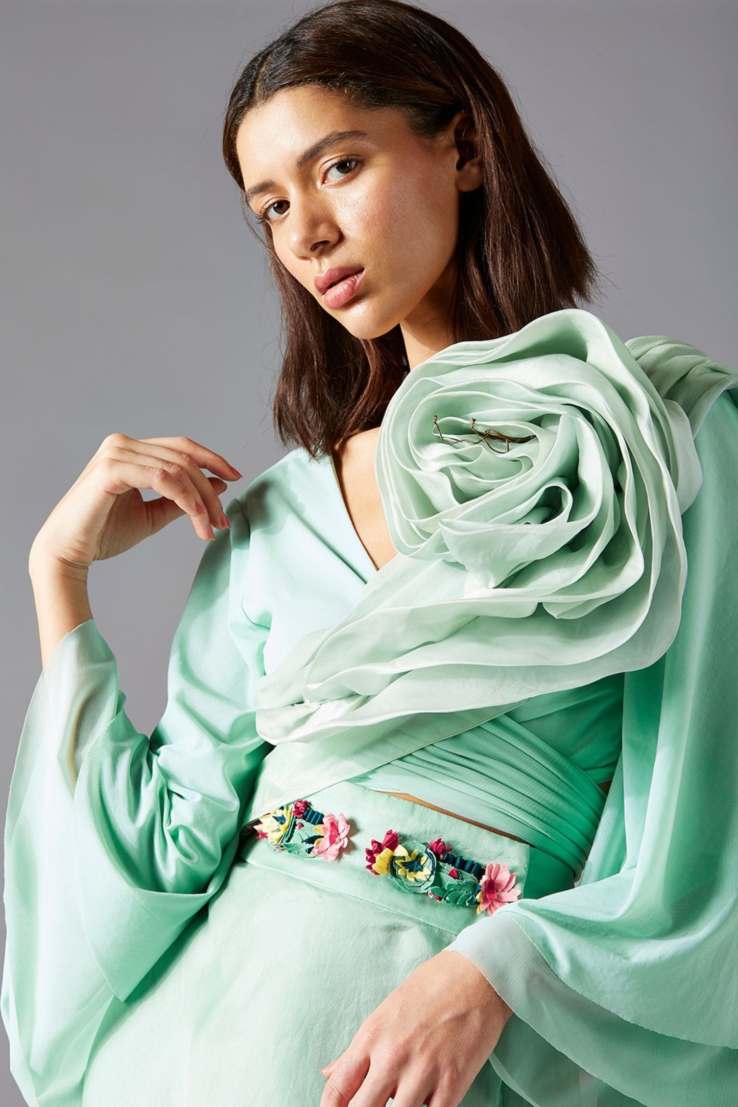 Close-up of the floral embroidery on the blouse and skirt dress, showcasing intricate detailing and delicate design