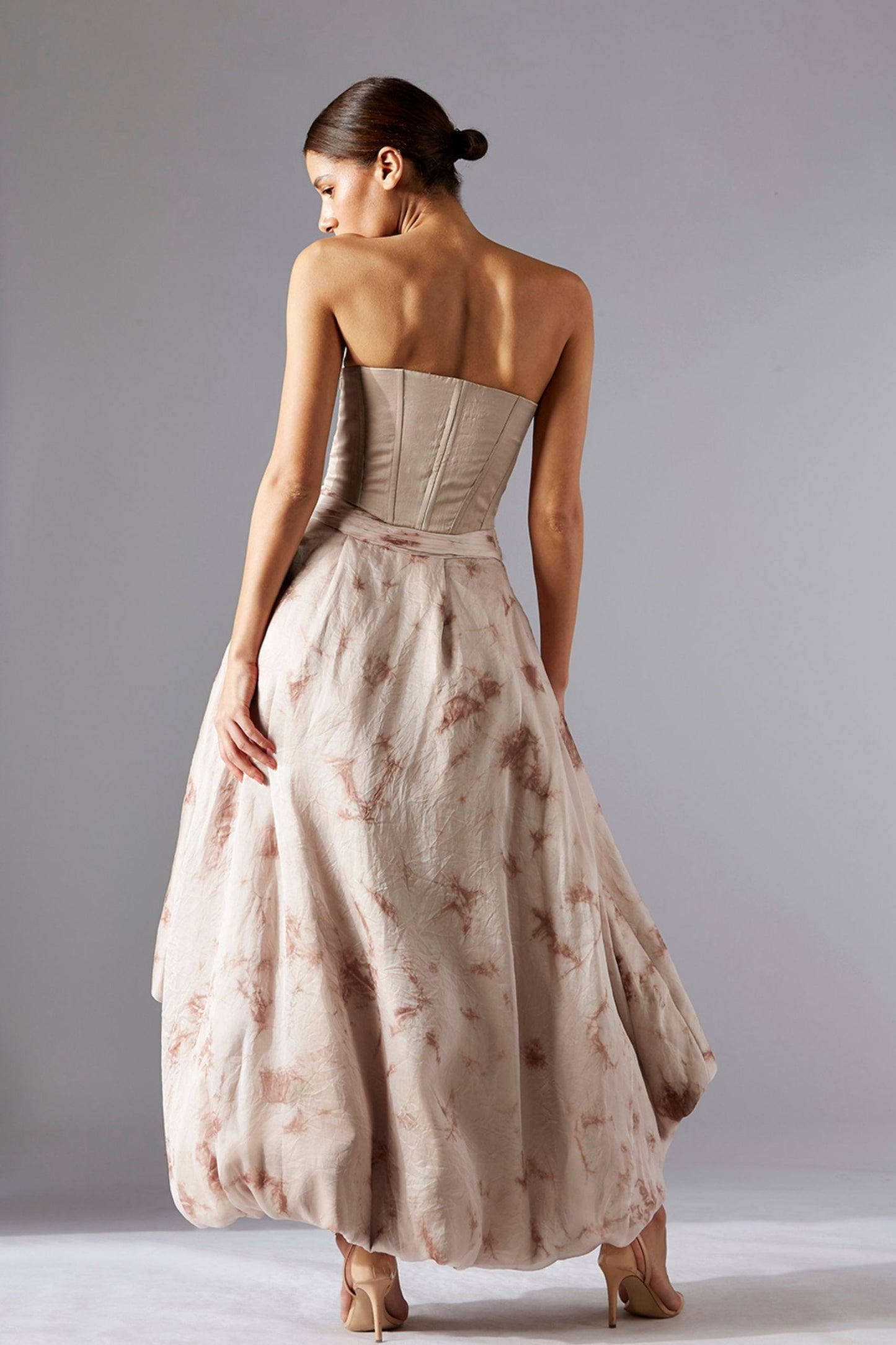 Back view of the Nargis corset & skirt set, showcasing the corset's fit and the elegant flow of the batik skirt