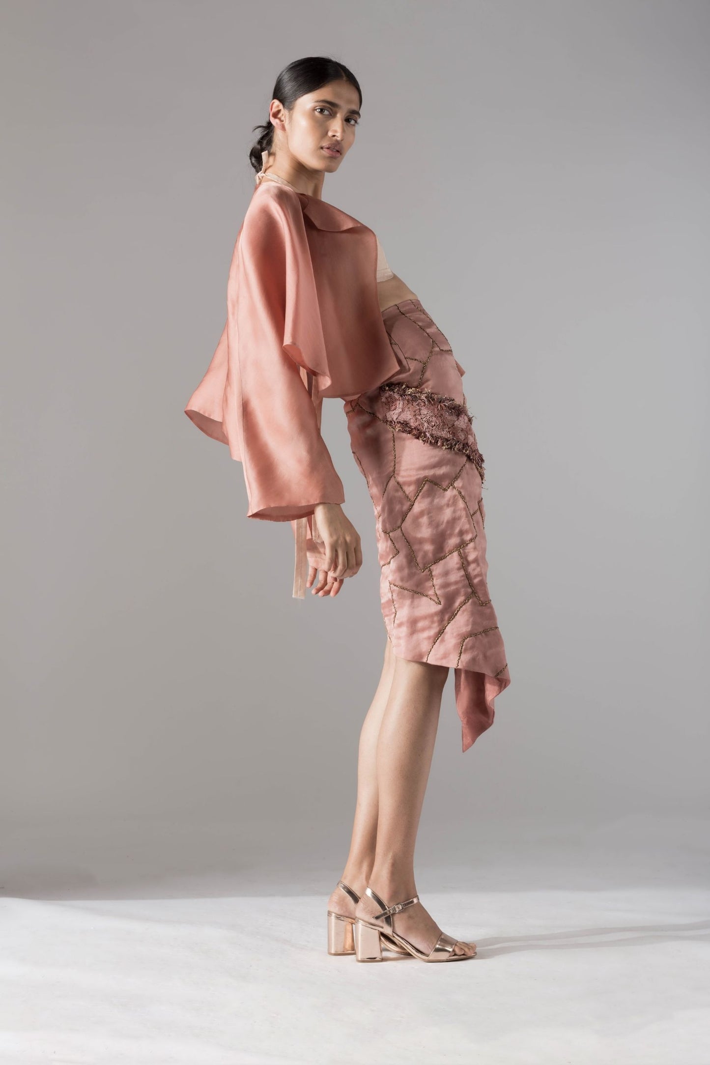 Side view of the Maze Scrawled skirt and jacket set, emphasizing the modern silhouette and stylish fit