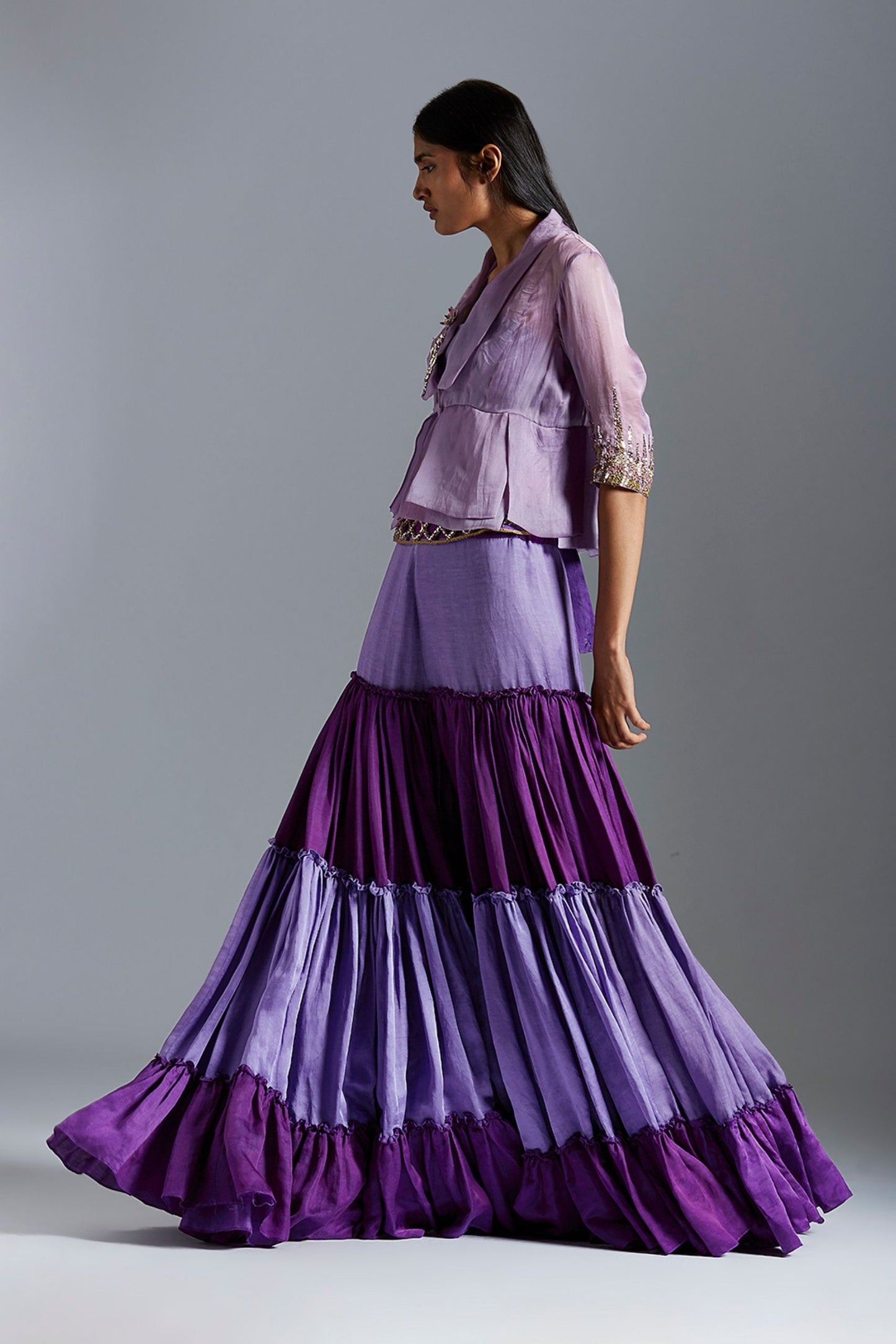 Side view of the blouse and sharara dress, emphasizing the flow of the sharara and the elegant pleats of the blouse