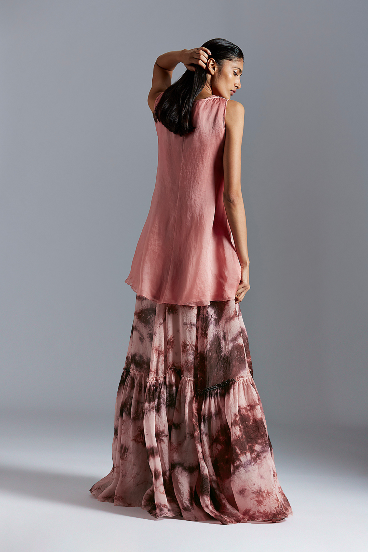 Back view of the skirt suit, emphasizing the elegant design and detailed batik work