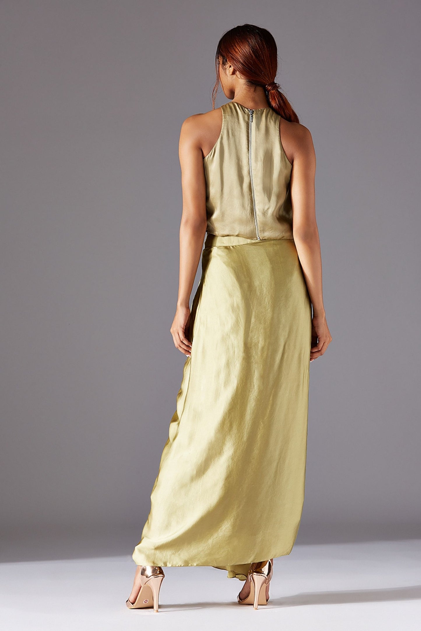 Back view featuring the stylish designer top and draped dhoti skirt for a contemporary and chic appearance