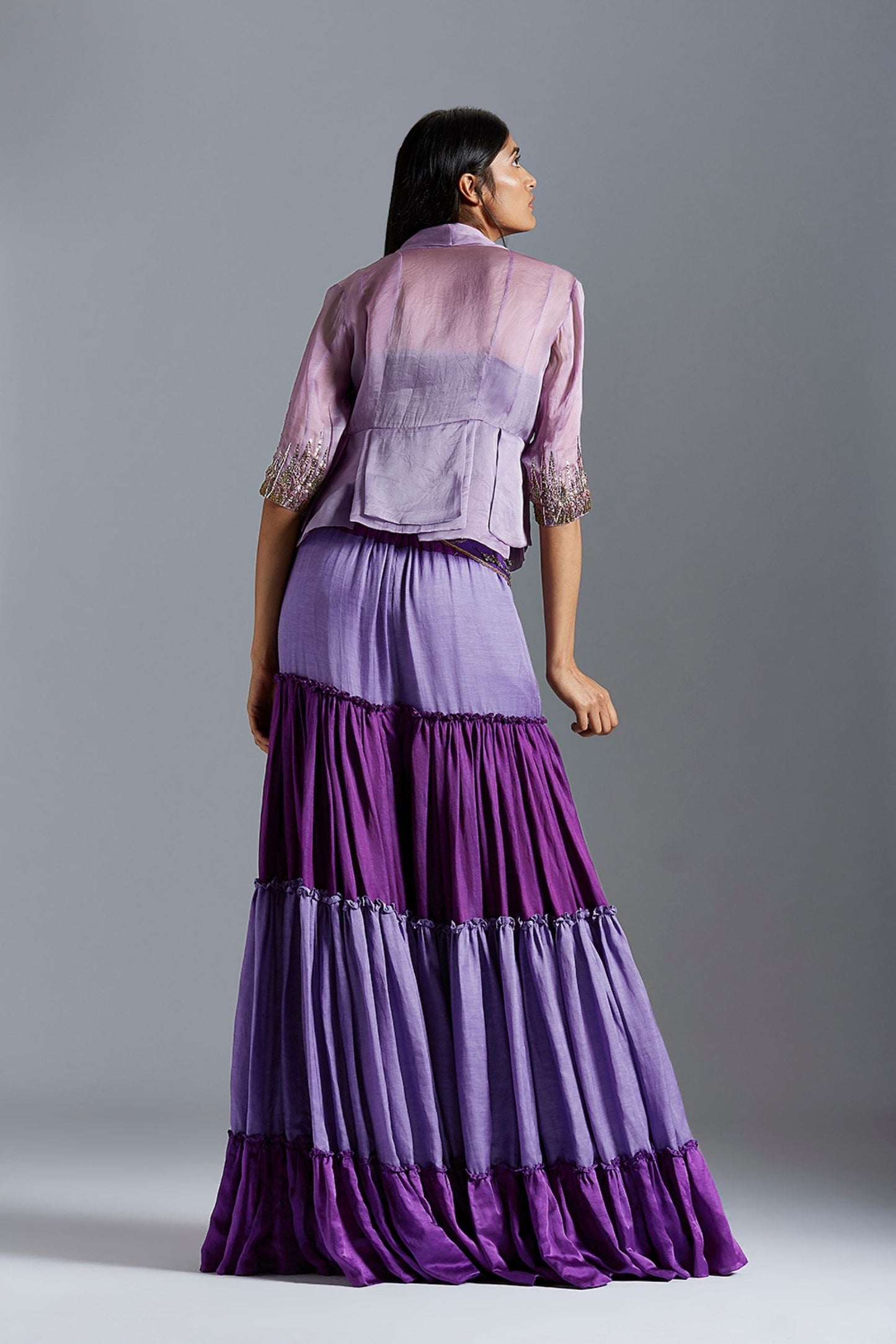 Back view of the blouse and sharara dress, highlighting the fit and elegant design of the pleated blouse and sharara