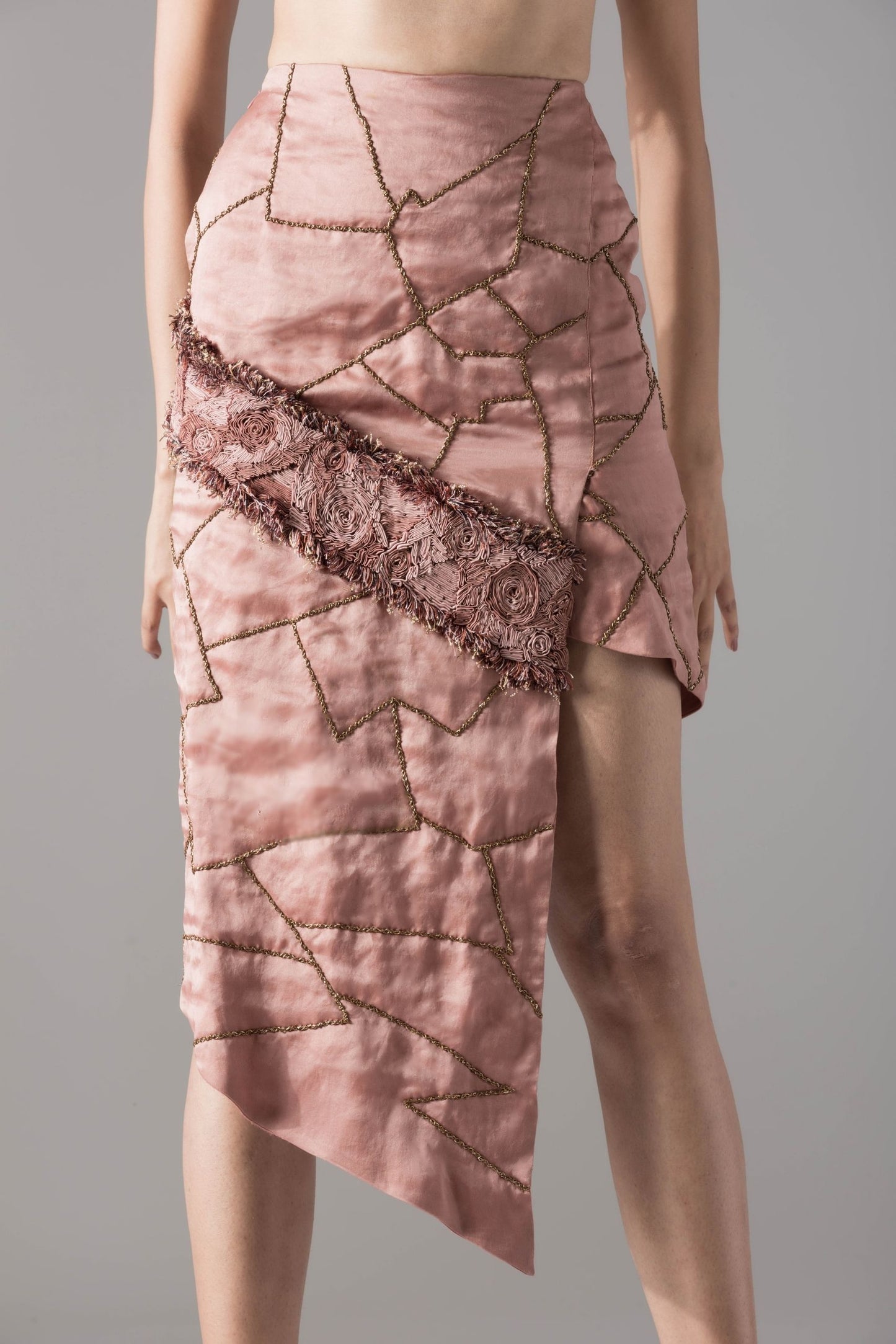 Focused shot of the Maze Scrawled skirt, highlighting the fine hand embroidery and sleek silhouette